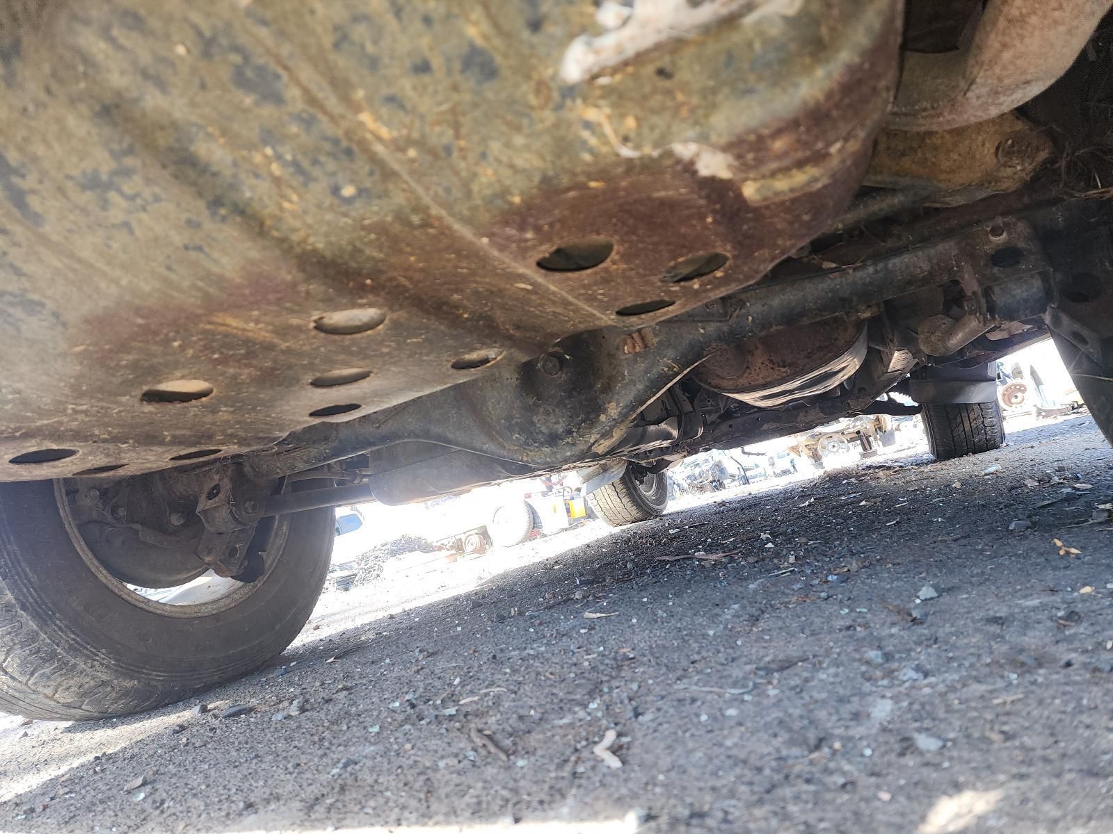 Underneath a Rusty Vehicle — South West 4WD Wreckers In Harristown, QLD