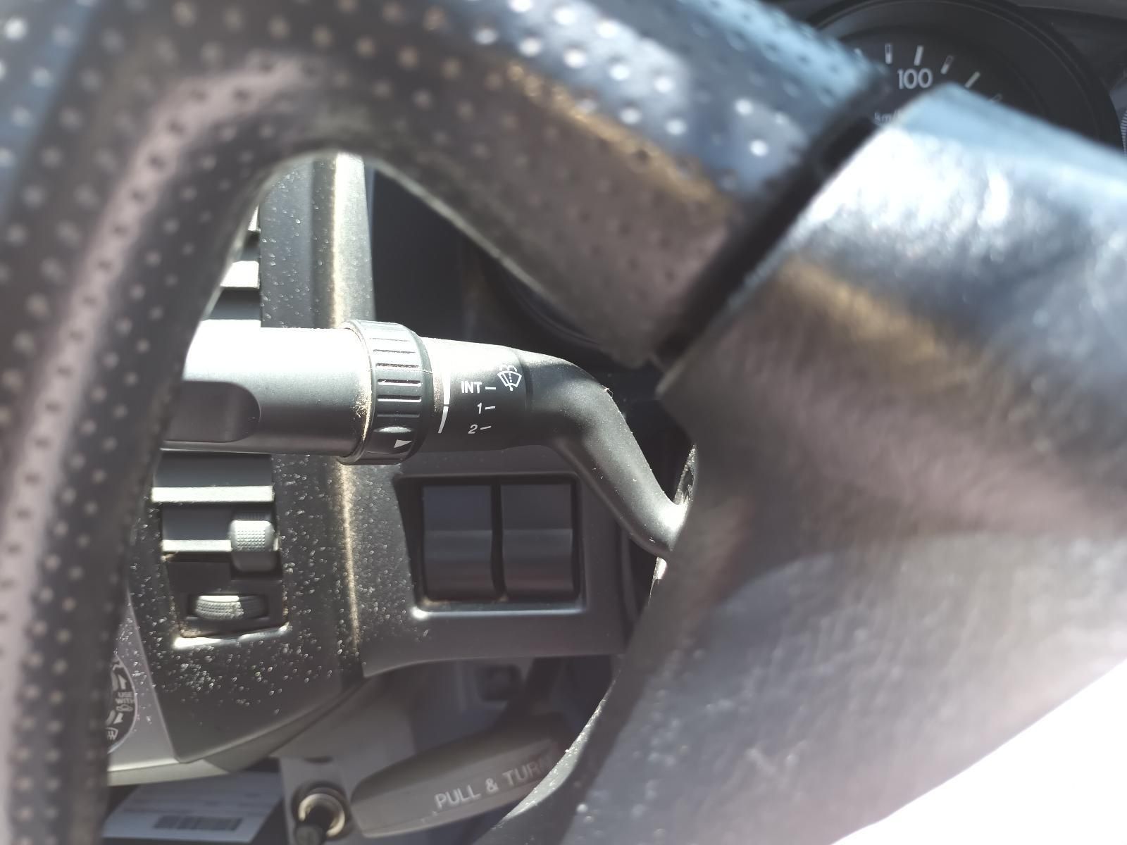 Close-Up of A Car Steering Wheel and Dashboard Controls in Black and Silver — South West 4WD Wreckers In Harristown, QLD