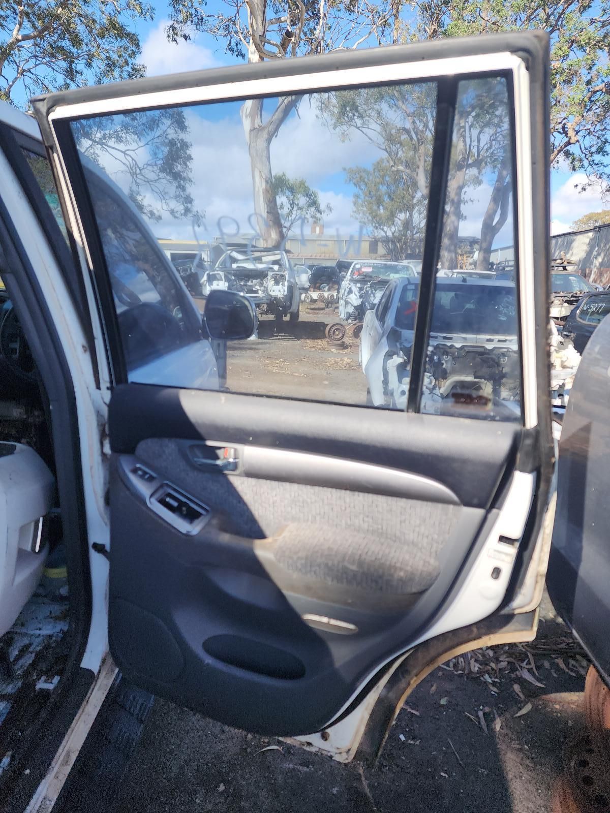 Open Car Door With Tinted Window — South West 4WD Wreckers In Harristown, QLD