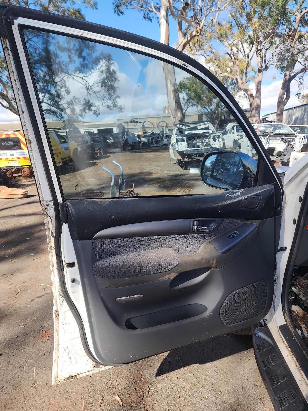 Open Car Door With Black Interior — South West 4WD Wreckers In Harristown, QLD