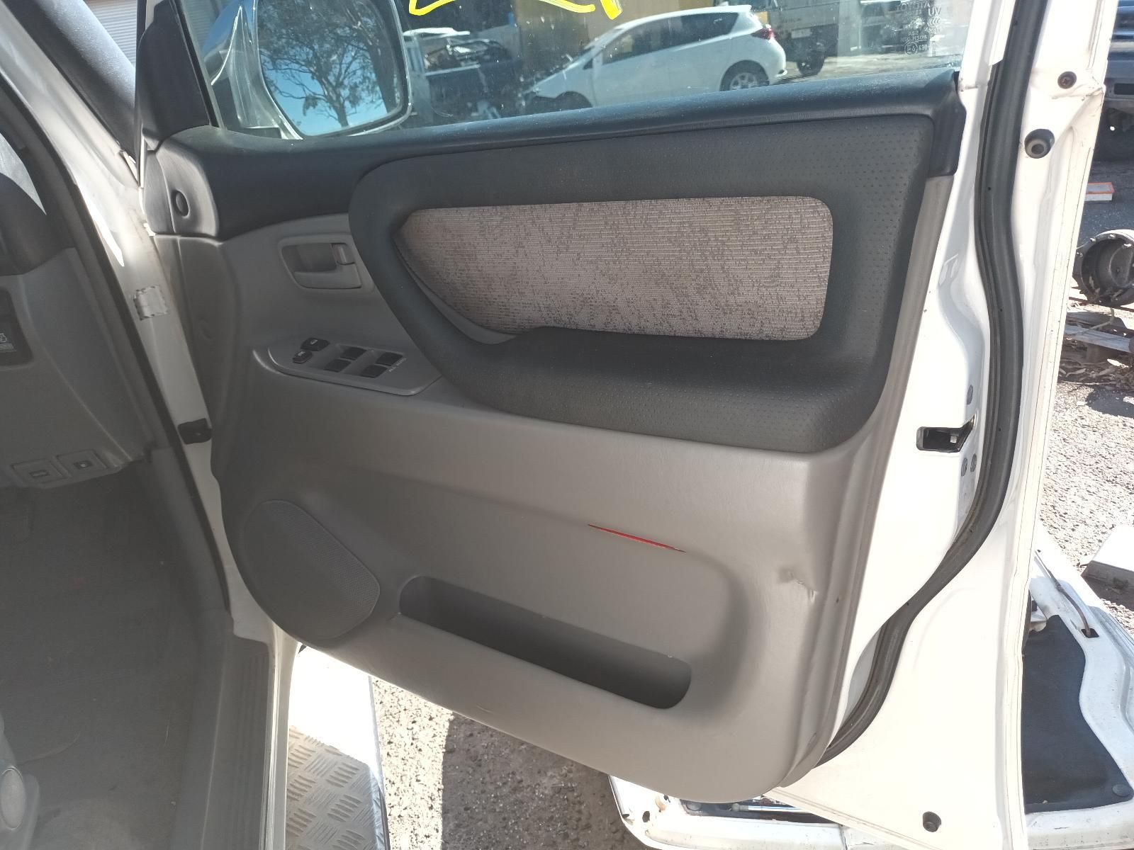 Open Car Door with Grey and Black Interior Trim and A Fabric Insert Panel — South West 4WD Wreckers In Harristown, QLD