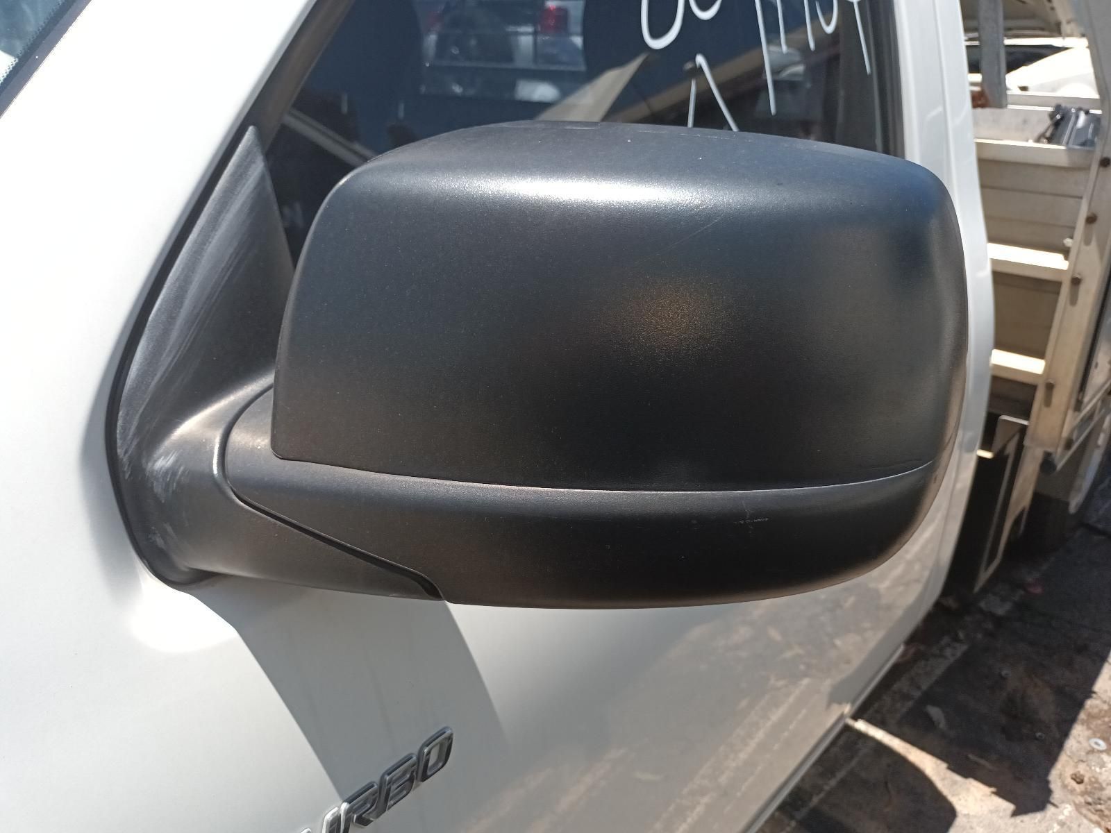 Black Side Mirror on A White Vehicle Outdoors in Sunlight — South West 4WD Wreckers In Harristown, QLD