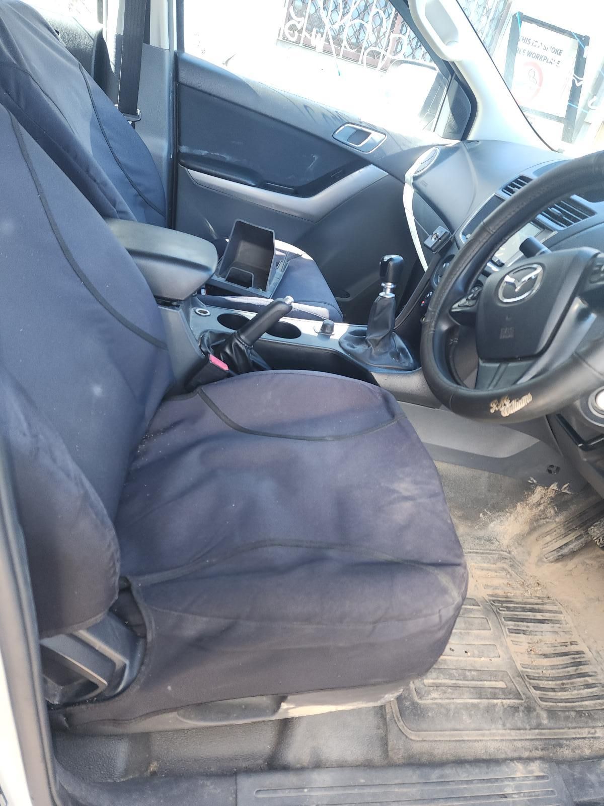 Car Interior With Black Seat Covers, Steering Wheel — South West 4WD Wreckers In Harristown, QLD