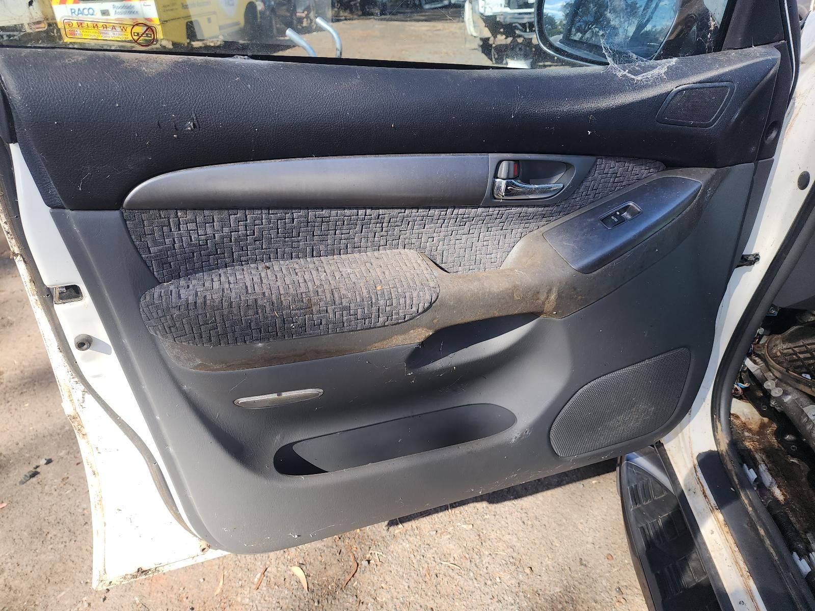 Open Car Door With Black and Gray Interior Panel — South West 4WD Wreckers In Harristown, QLD