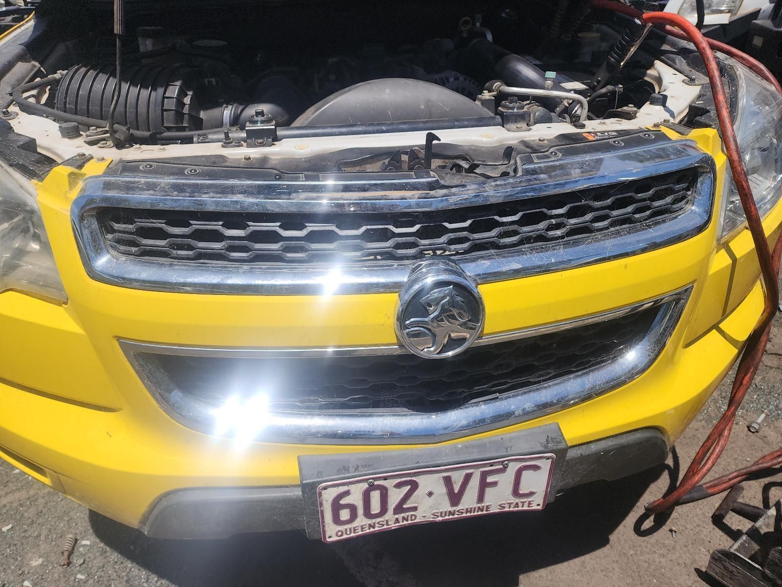 Yellow Car Front With Open Hood — South West 4WD Wreckers In Harristown, QLD