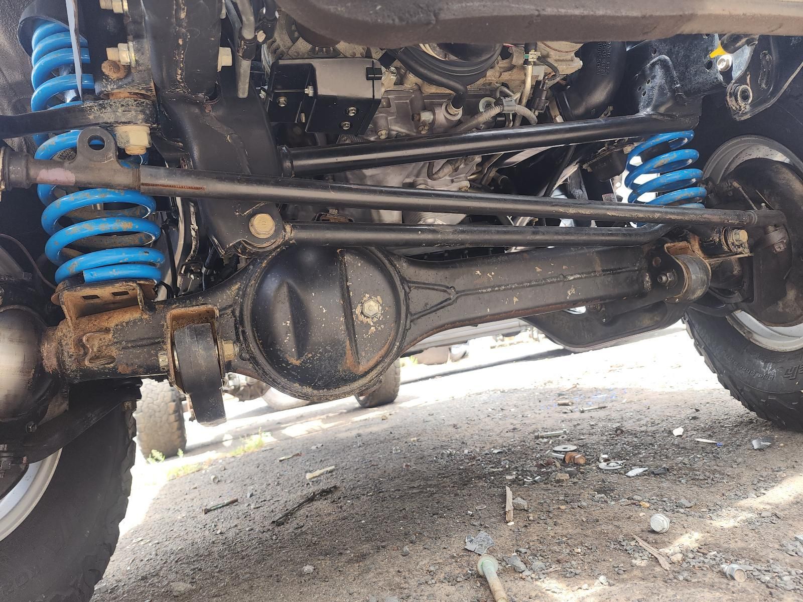 Undercarriage of a Vehicle With Blue Coil Springs — South West 4WD Wreckers In Harristown, QLD