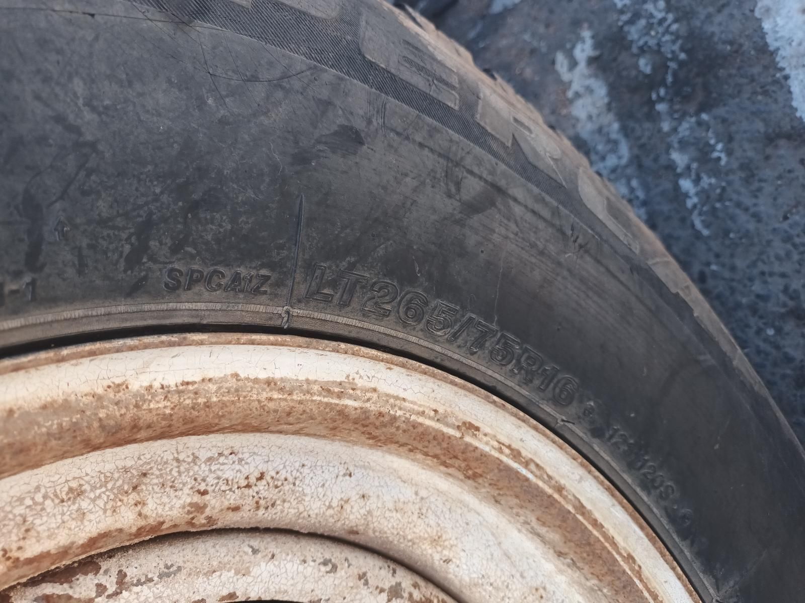Close-Up of A Worn Tyre and Rusty White Wheel Rim on A Vehicle — South West 4WD Wreckers In Harristown, QLD