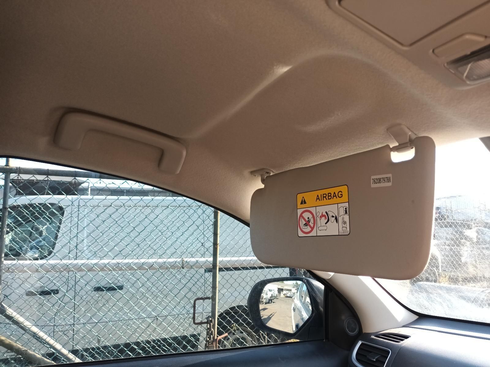 Car Interior with Sun Visor Down, Side Mirror Visible — South West 4WD Wreckers In Harristown, QLD