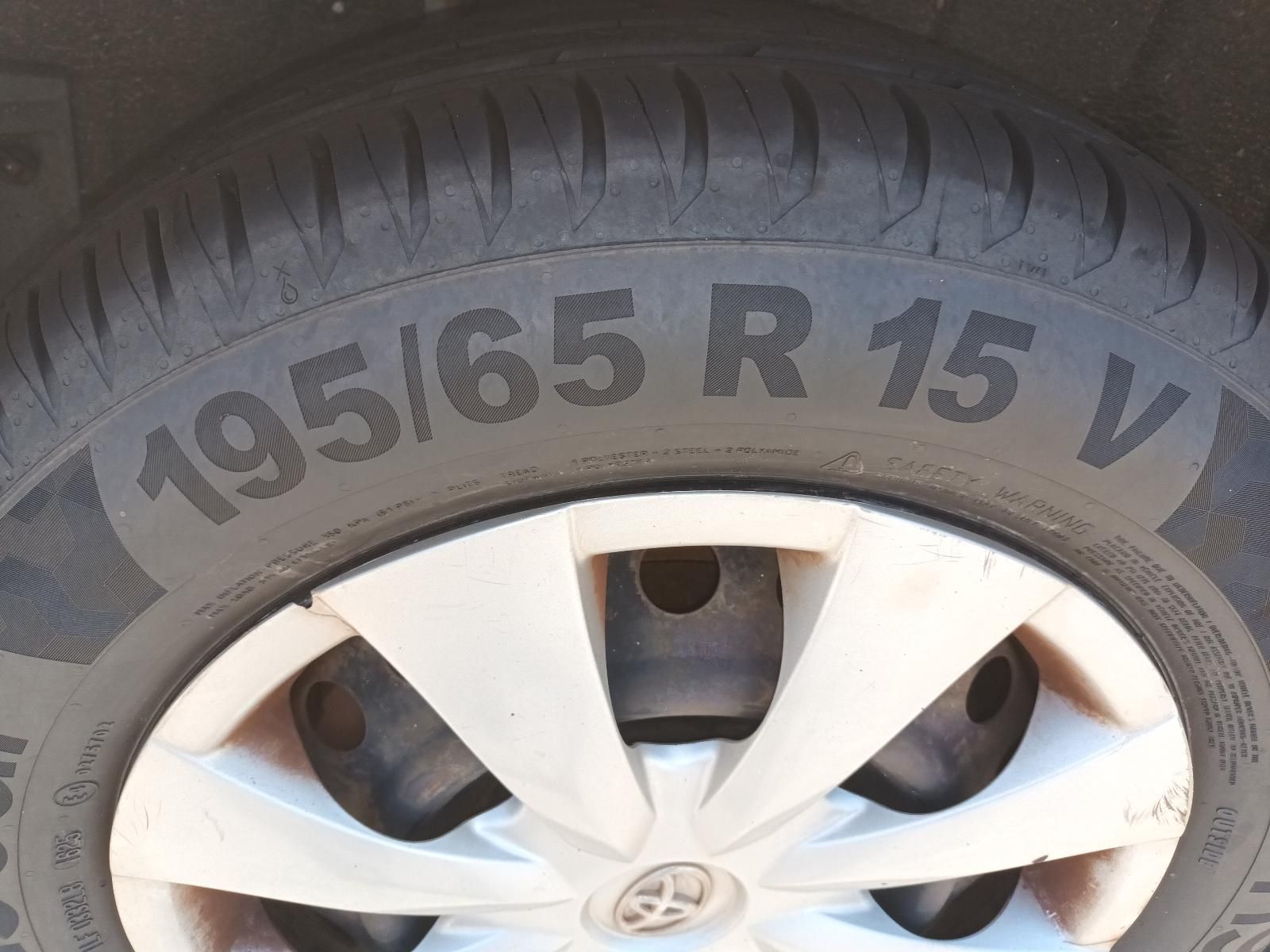 Close-Up of A Car Wheel with A Silver Rim and Tire Showing Size 195/65 R15 V1 — South West 4WD Wreckers In Harristown, QLD
