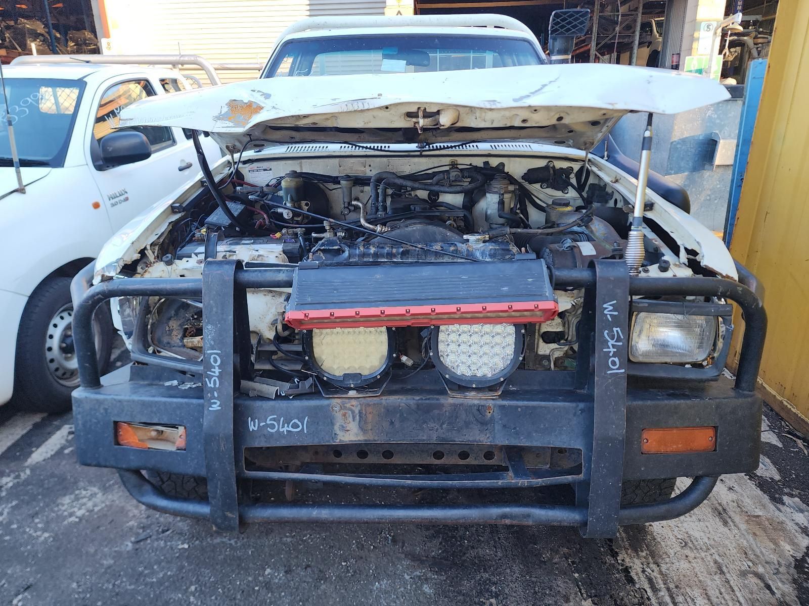 Front View of a Damaged Black Pickup Truck — South West 4WD Wreckers In Harristown, QLD