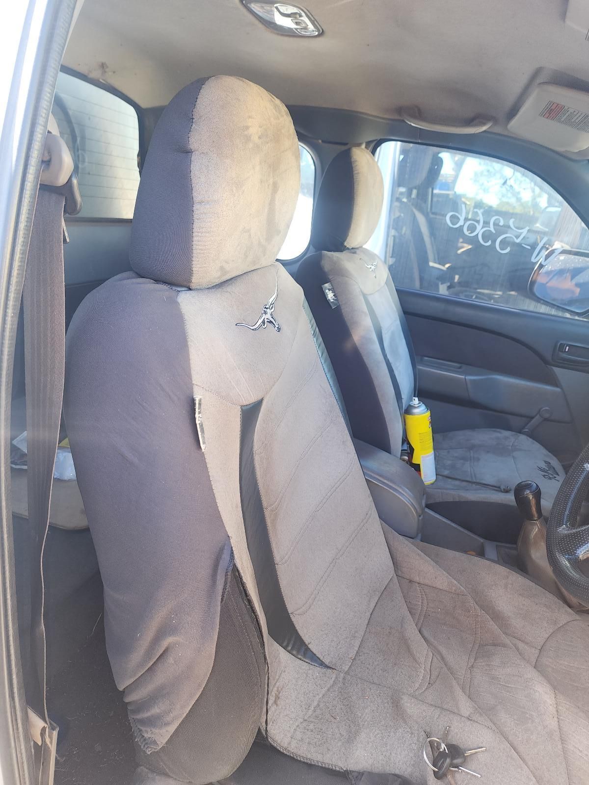 Crumpled Beige Car Seat Cover in a Vehicle Interior — South West 4WD Wreckers In Harristown, QLD