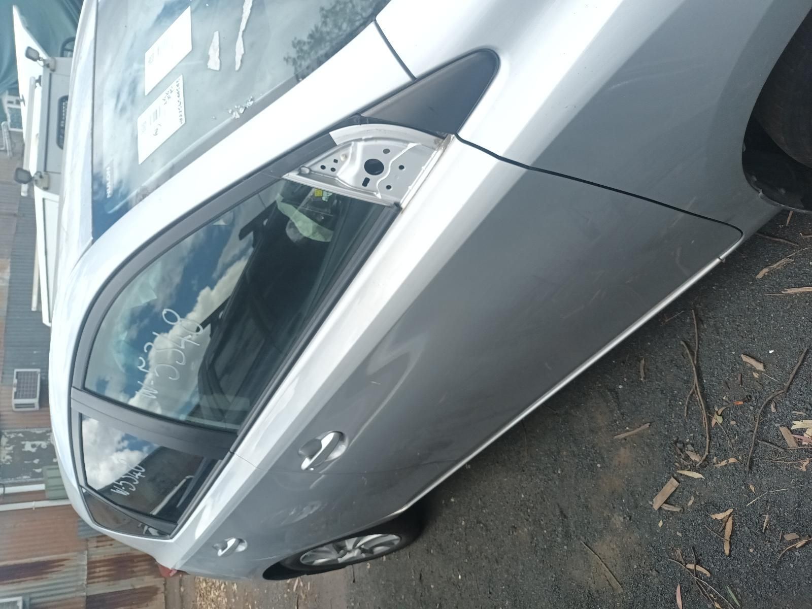 Silver Car Parked at An Angle on A Wet Street, Front End Visible — South West 4WD Wreckers In Harristown, QLD
