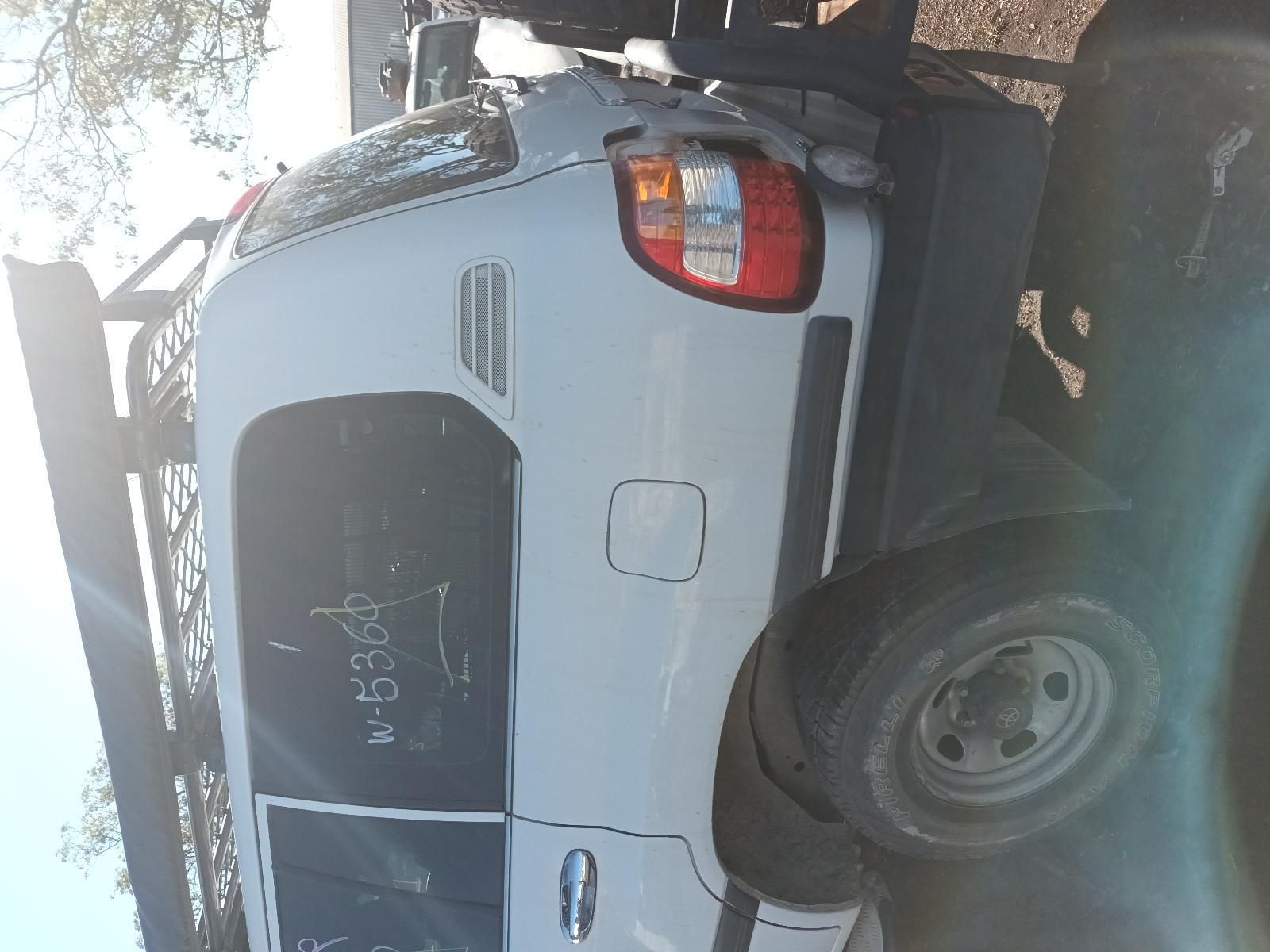 White Suv Parked on A Street, Viewed from The Side with Rear Wheel — South West 4WD Wreckers In Harristown, QLD