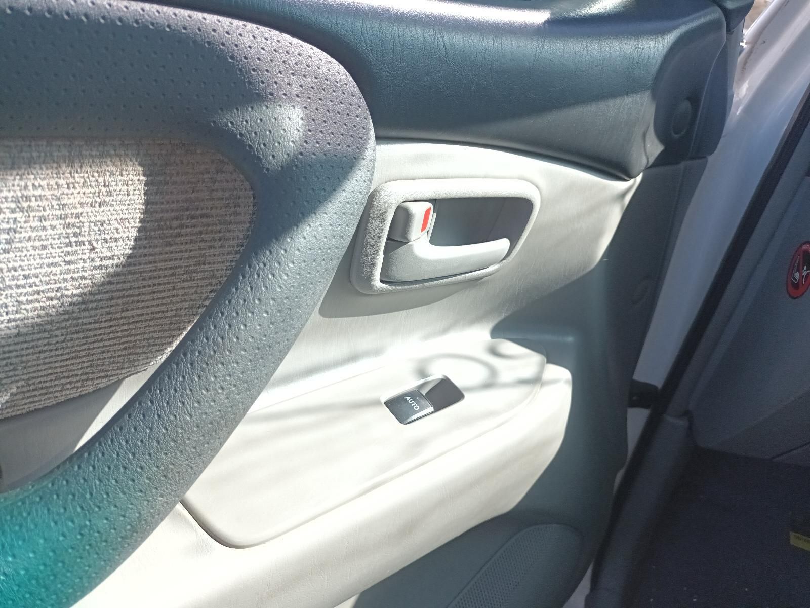 Car Interior with Gray Cloth Seat, White Door Panel, and Window Controls — South West 4WD Wreckers In Harristown, QLD