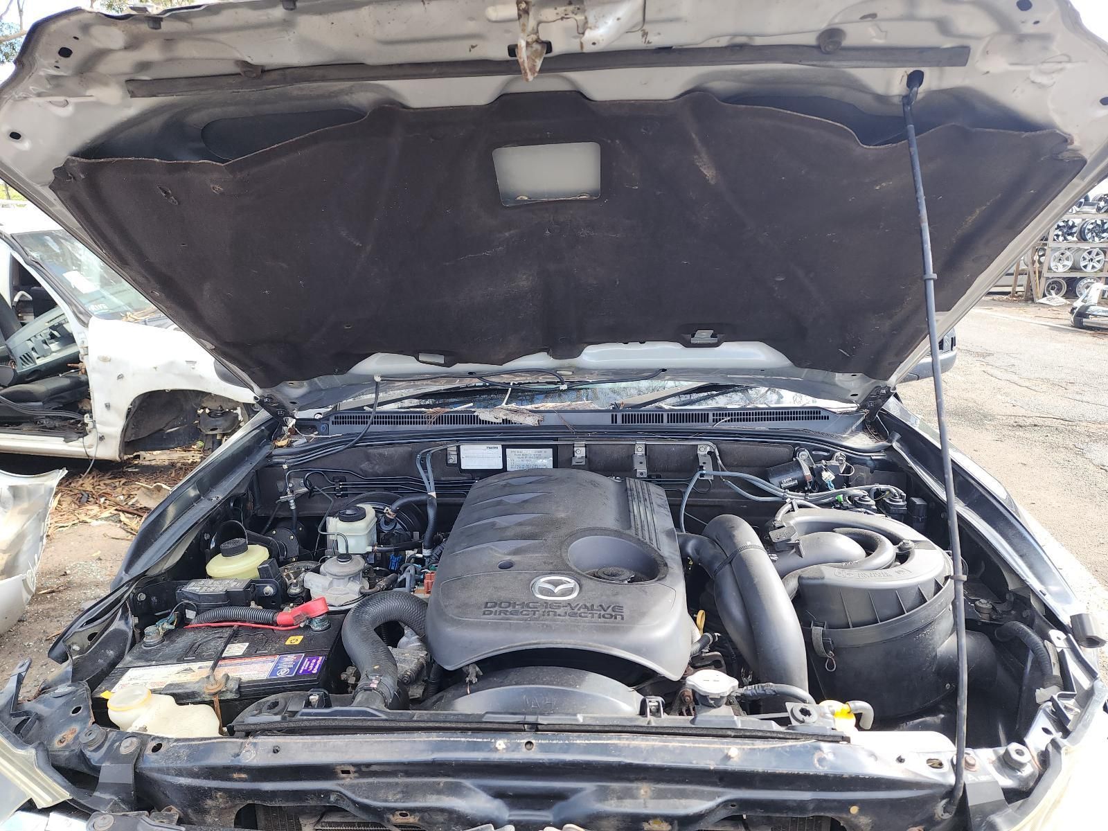 Car Engine Compartment With Hood Open — South West 4WD Wreckers In Harristown, QLD