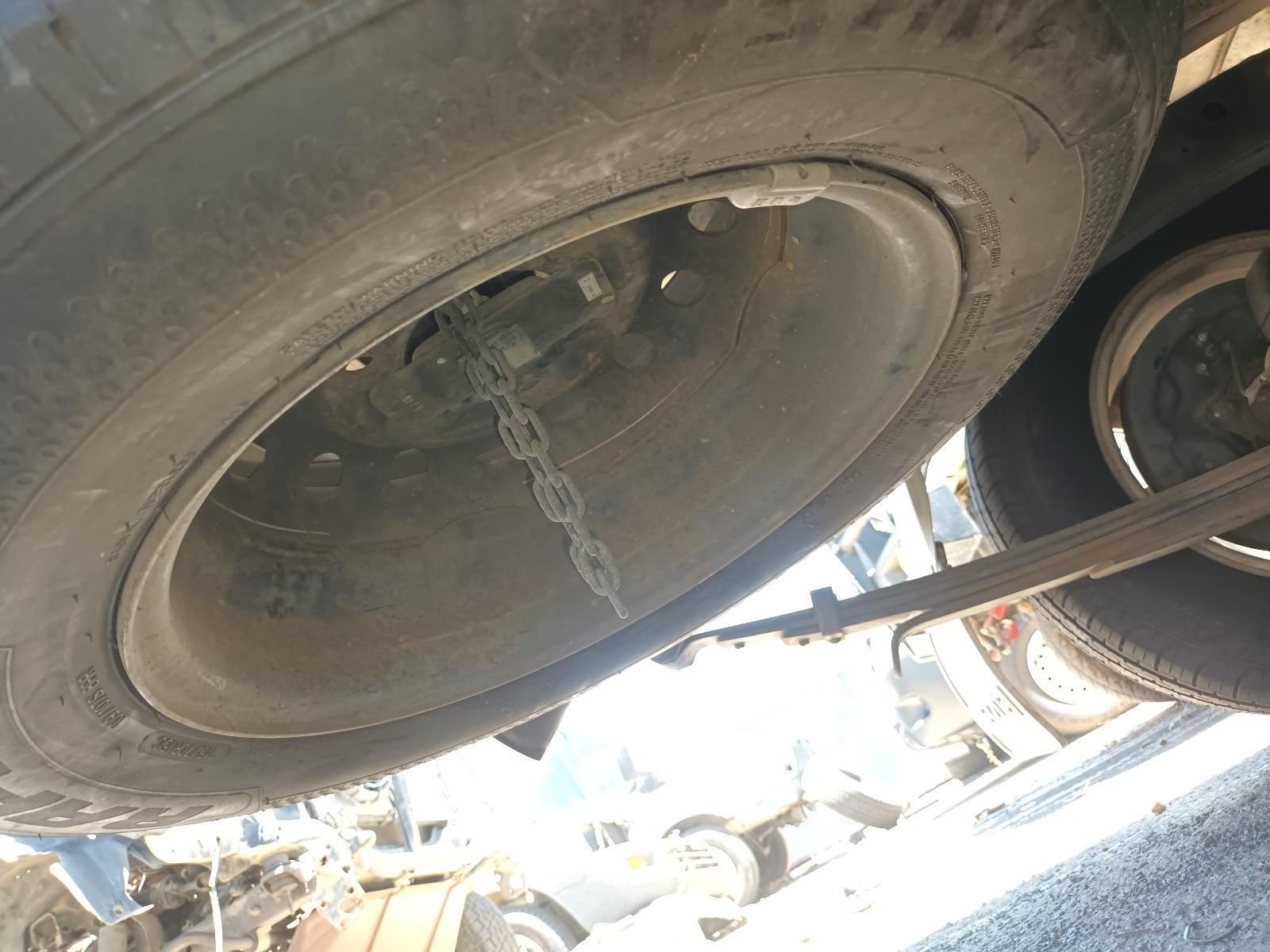 Underside of A Vehicle with A Large Tyre and Chain Visible — South West 4WD Wreckers In Harristown, QLD