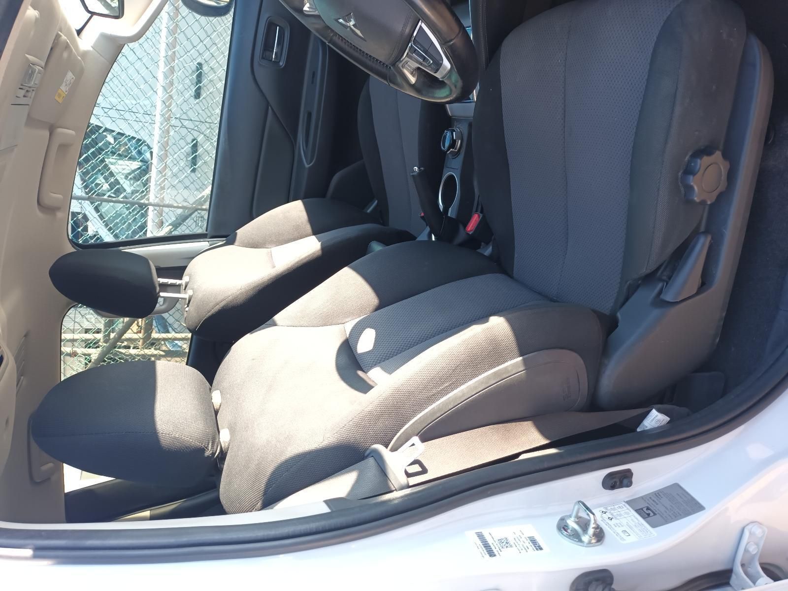 Car Interior with Gray Cloth Front Seats and Steering Wheel — South West 4WD Wreckers In Harristown, QLD