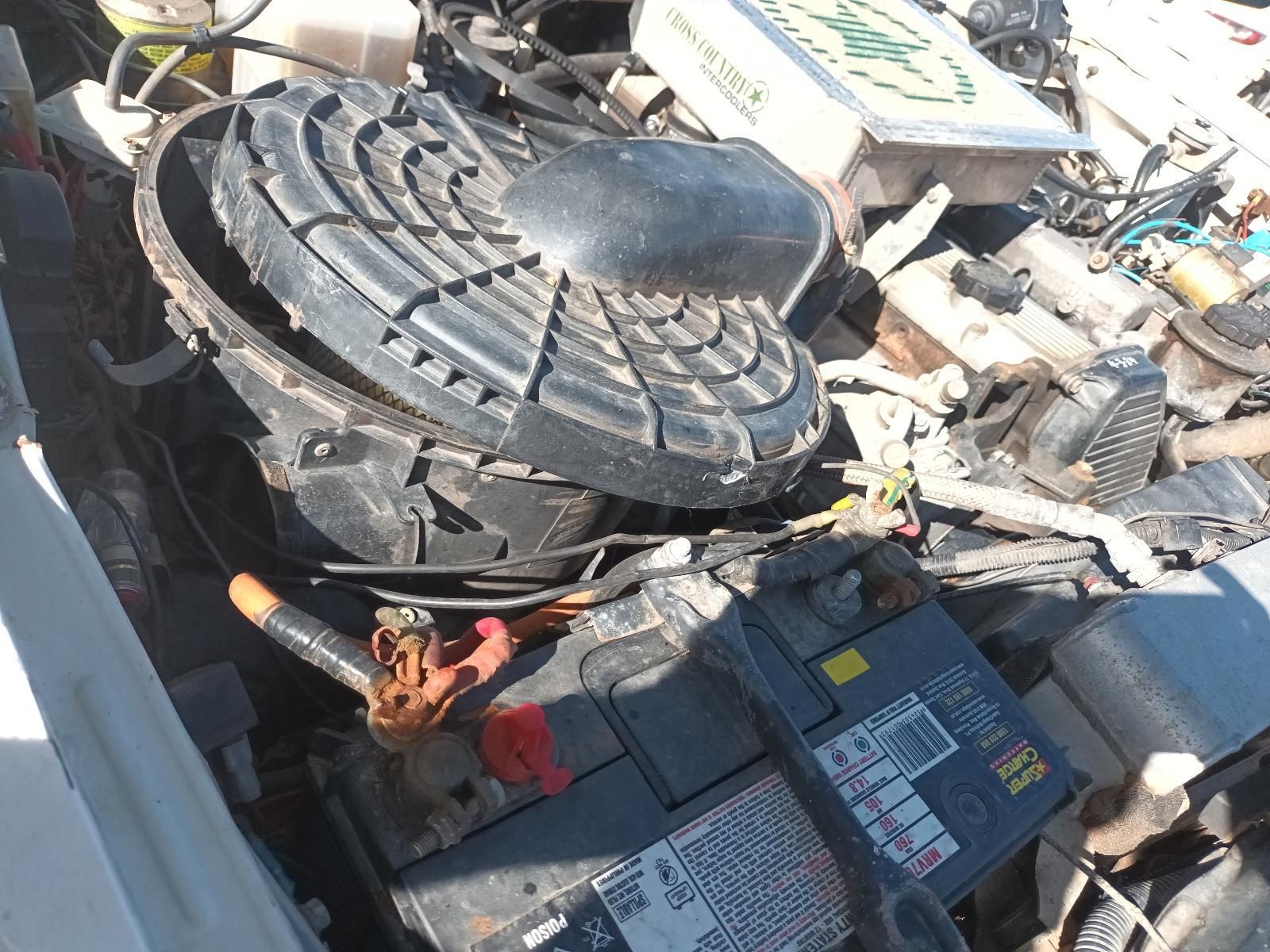 Car Engine Bay with A Large Round Air Filter Housing — South West 4WD Wreckers In Harristown, QLD