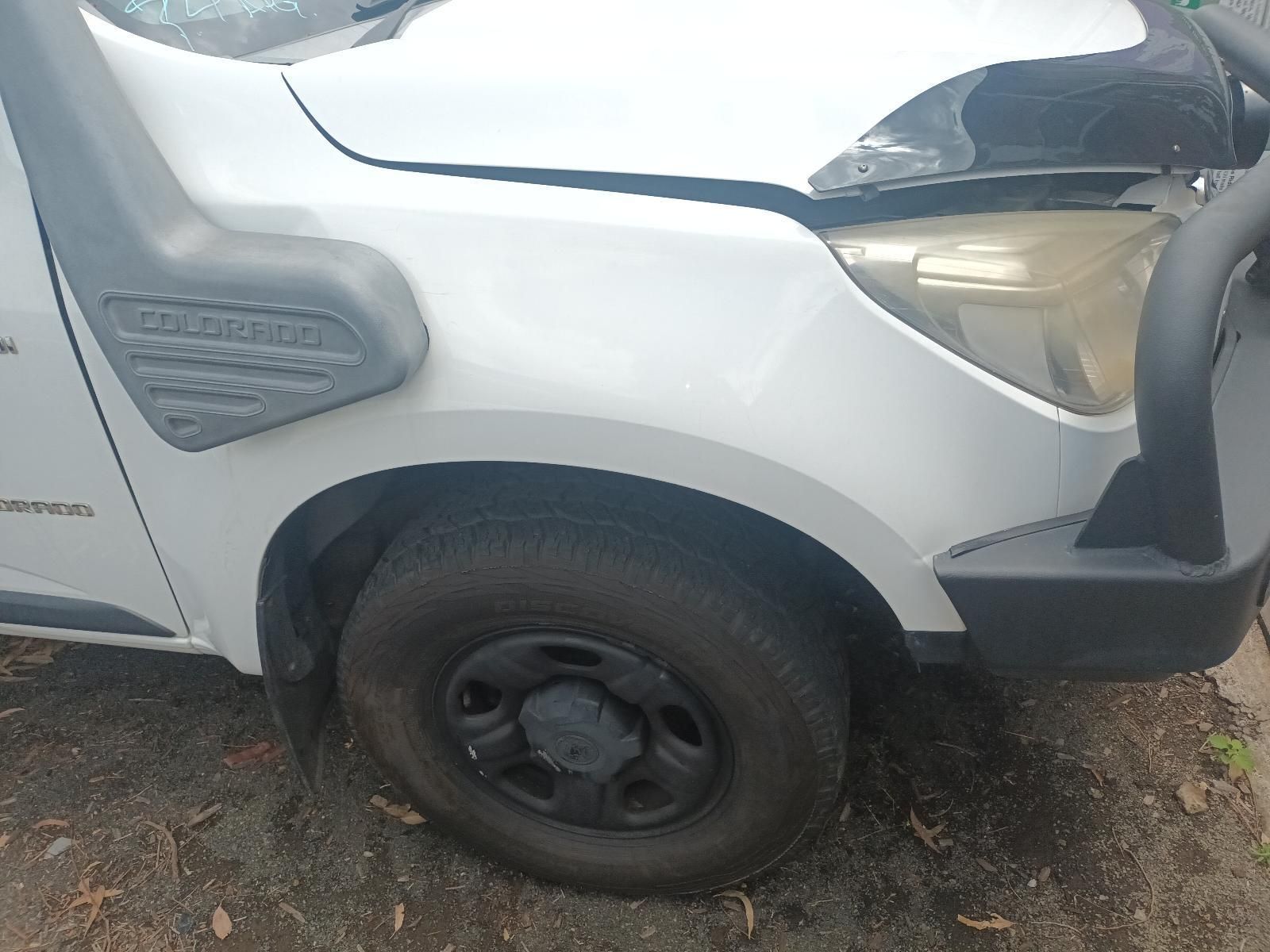 White Pickup Truck Front Side with Black Wheel on A Dirt Ground — South West 4WD Wreckers In Harristown, QLD