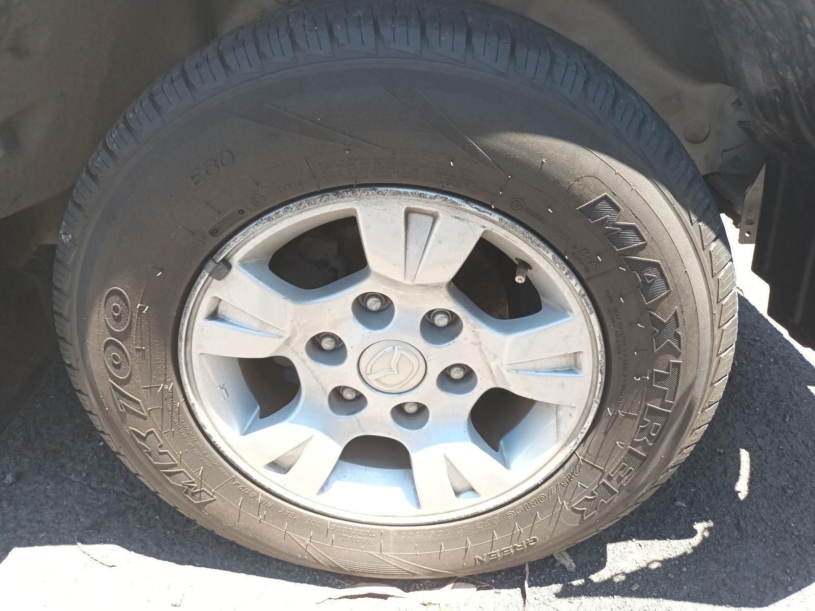 Close-Up of A Car Tyre and Silver Alloy Wheel on A Vehicle in Sunlight — South West 4WD Wreckers In Harristown, QLD