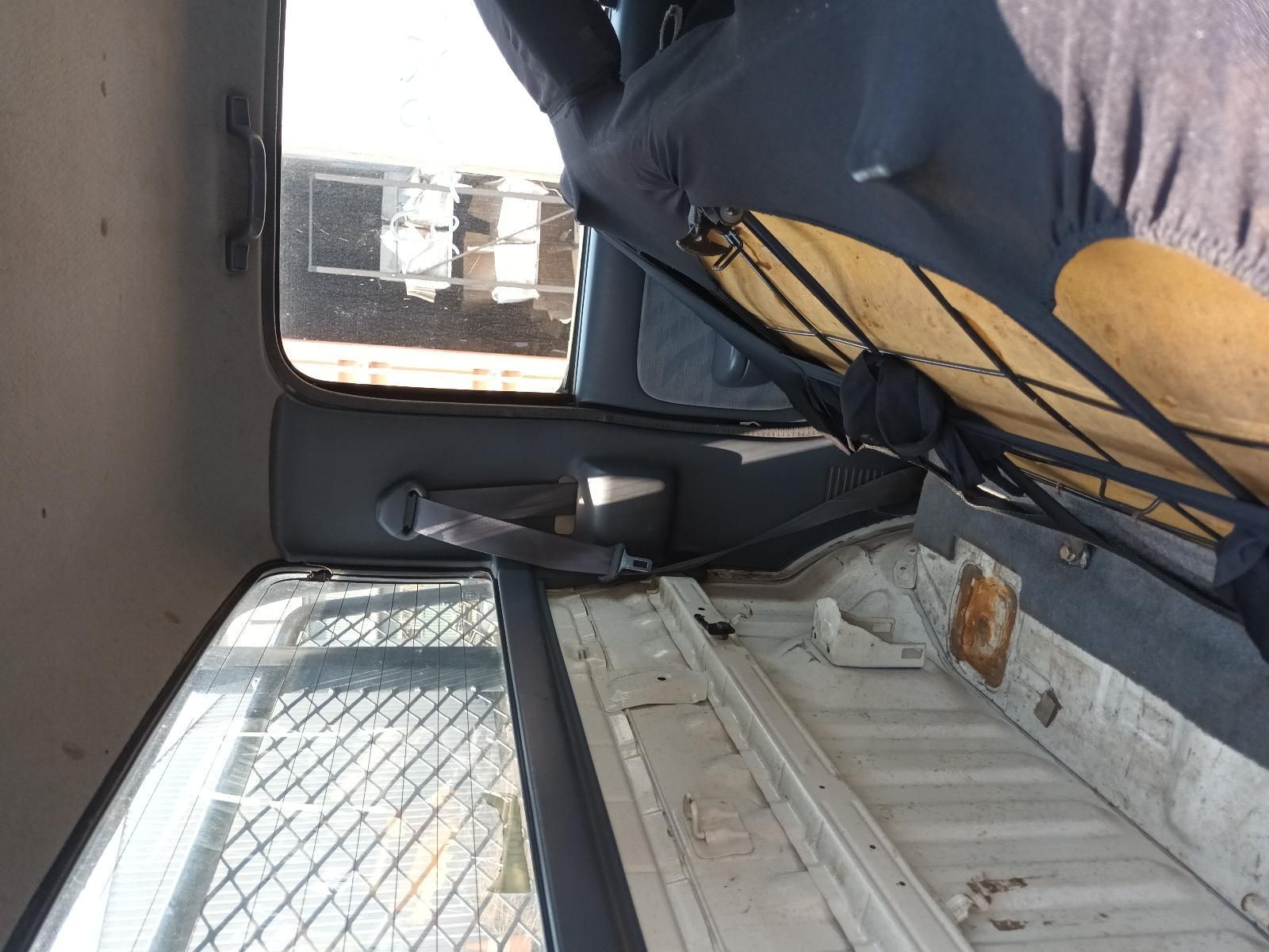 Interior of A Van with A Sleeping Bag, Window, and Grey Seat — South West 4WD Wreckers In Harristown, QLD