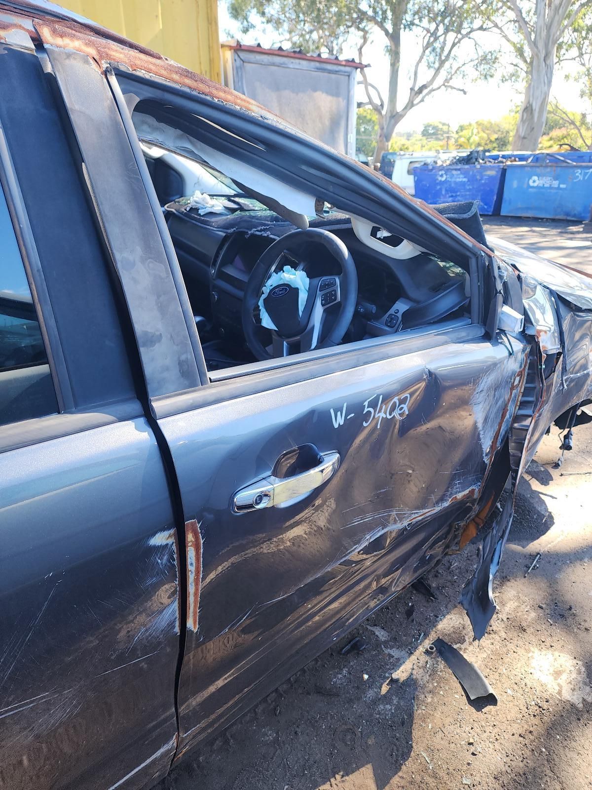 Damaged Black Car — South West 4WD Wreckers In Harristown, QLD