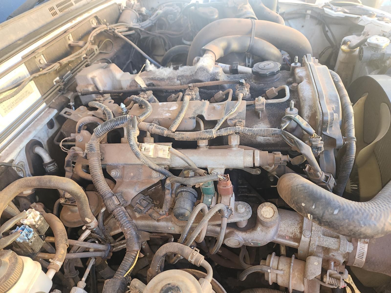 Close-up of a Dusty Car Engine Compartment — South West 4WD Wreckers In Harristown, QLD