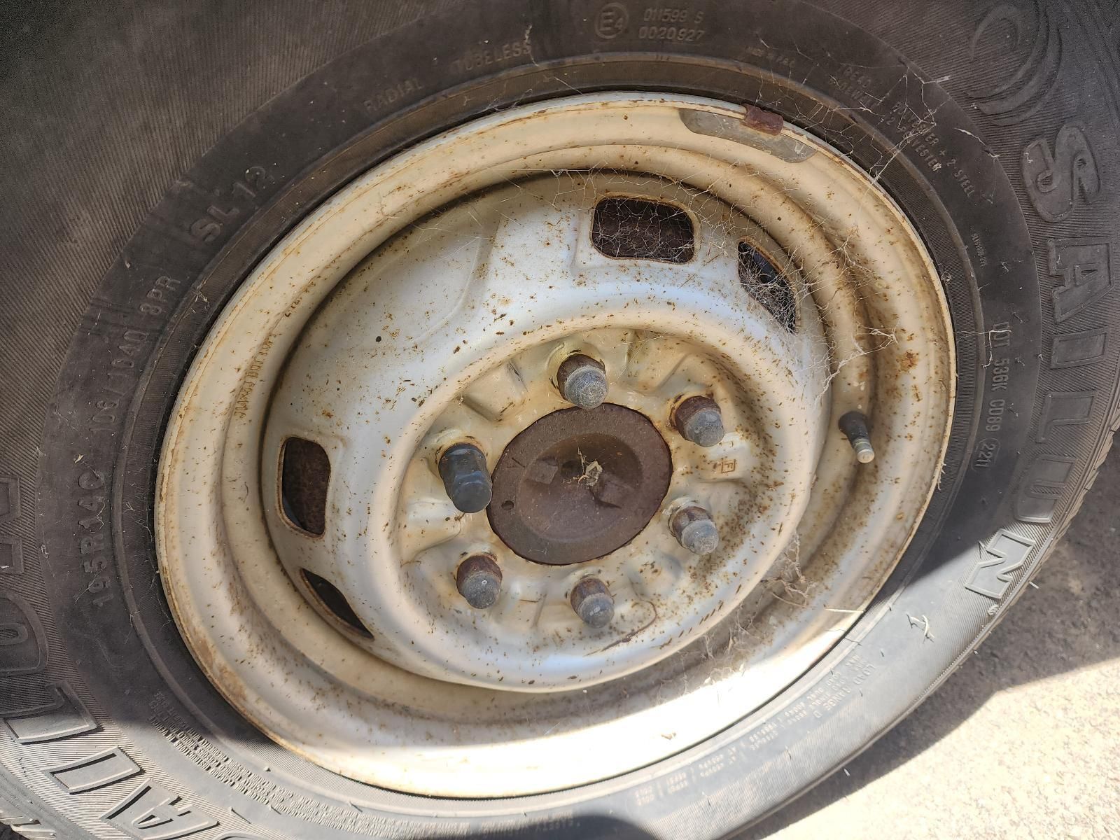 Rusty White Steel Wheel Rim on a Vehicle Tyre — South West 4WD Wreckers In Harristown, QLD