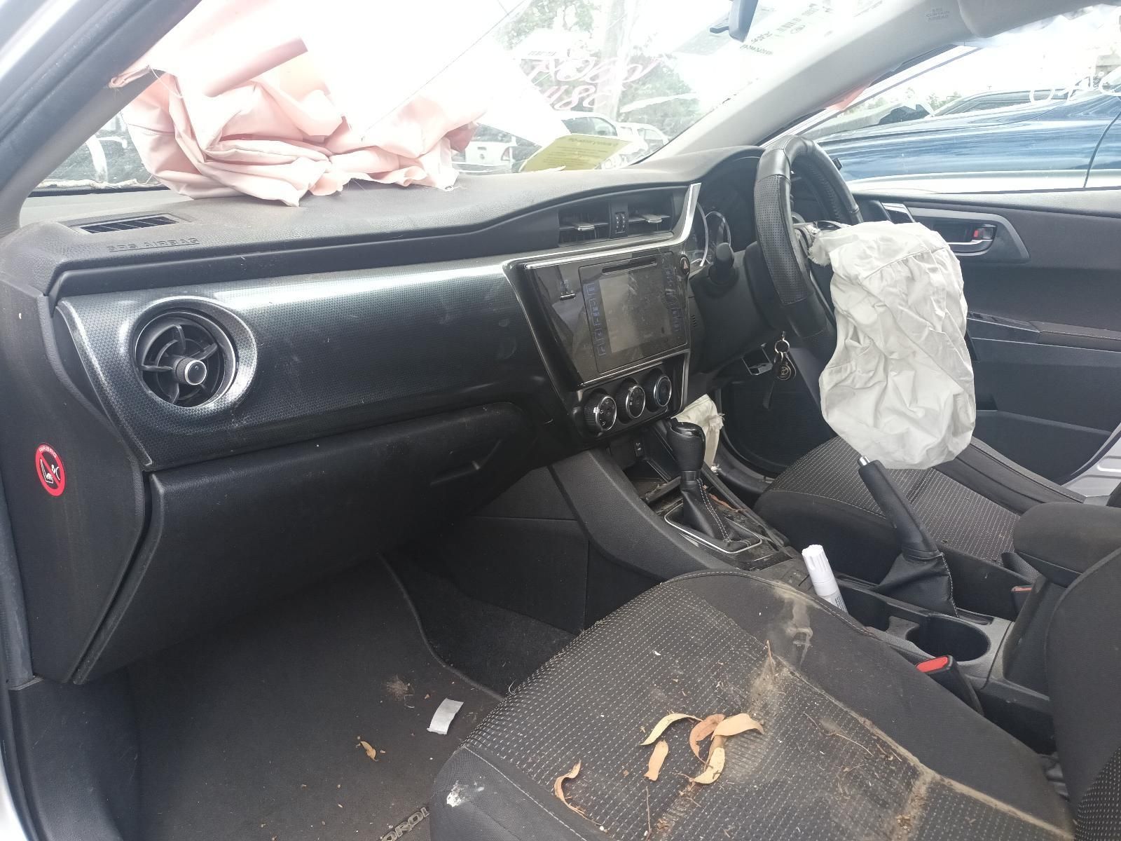 Damaged Car Interior with Deployed Airbags and Debris on The Seats and Dashboard — South West 4WD Wreckers In Harristown, QLD