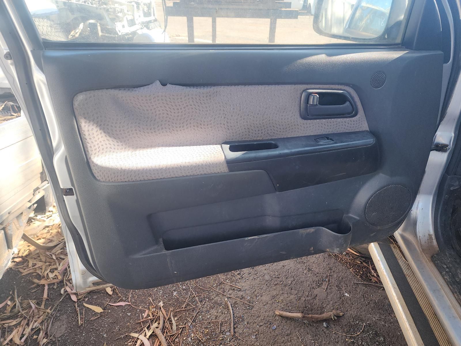 Close-Up of A Grey Car Door Interior with Handle, Speaker, and Storage Pocket — South West 4WD Wreckers In Harristown, QLD