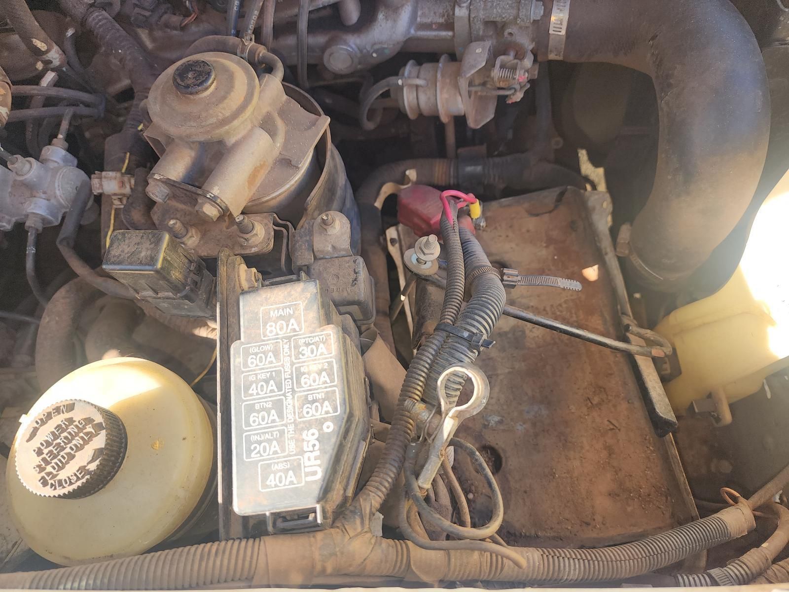 Engine Bay With Battery, Hoses, and Wiring — South West 4WD Wreckers In Harristown, QLD