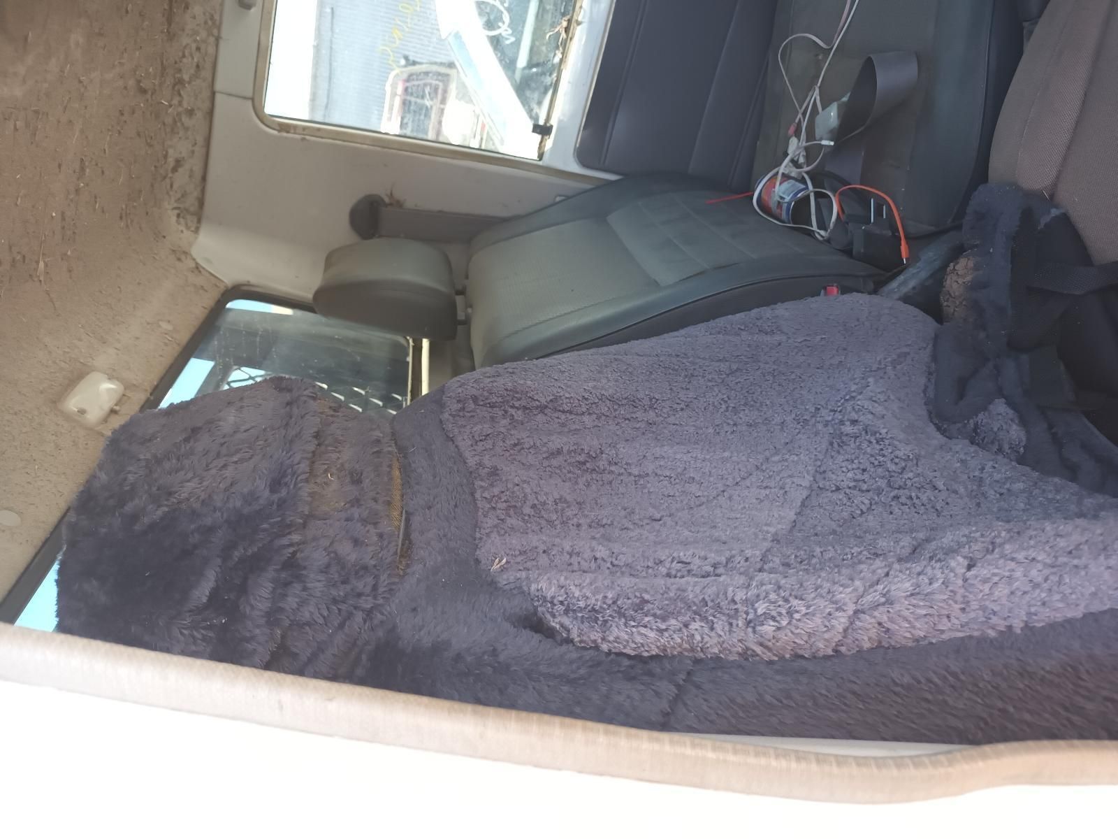 Person Resting in The Backseat of A Car with A Grey Blanket Covering Them — South West 4WD Wreckers In Harristown, QLD