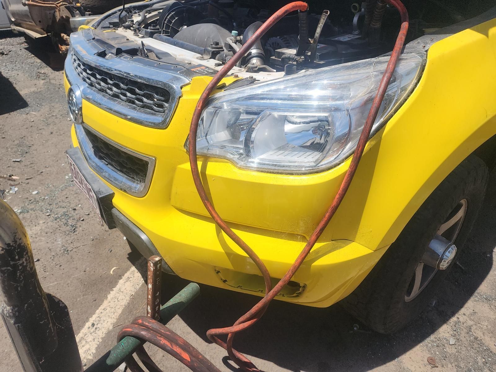 Yellow Car Front With Hood Open — South West 4WD Wreckers In Harristown, QLD