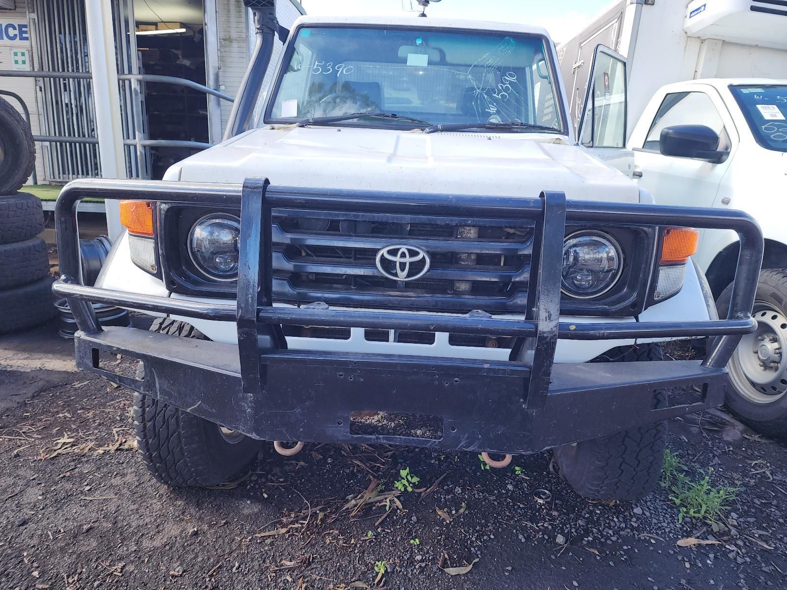 Front View of a White Toyota Off-road Truck — South West 4WD Wreckers In Harristown, QLD
