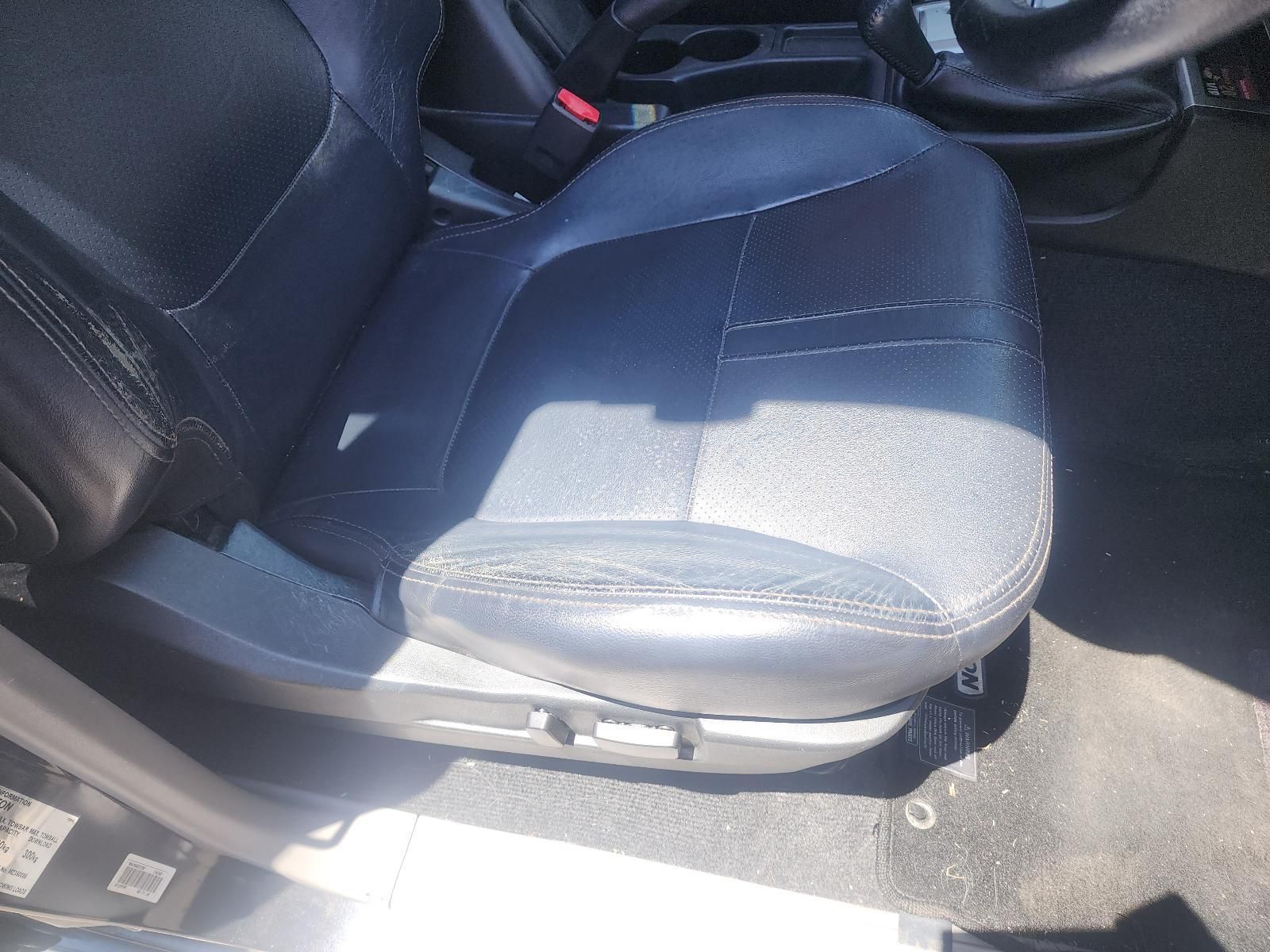 Dark Gray Car Seat With Bright Sunlight Glare — South West 4WD Wreckers In Harristown, QLD