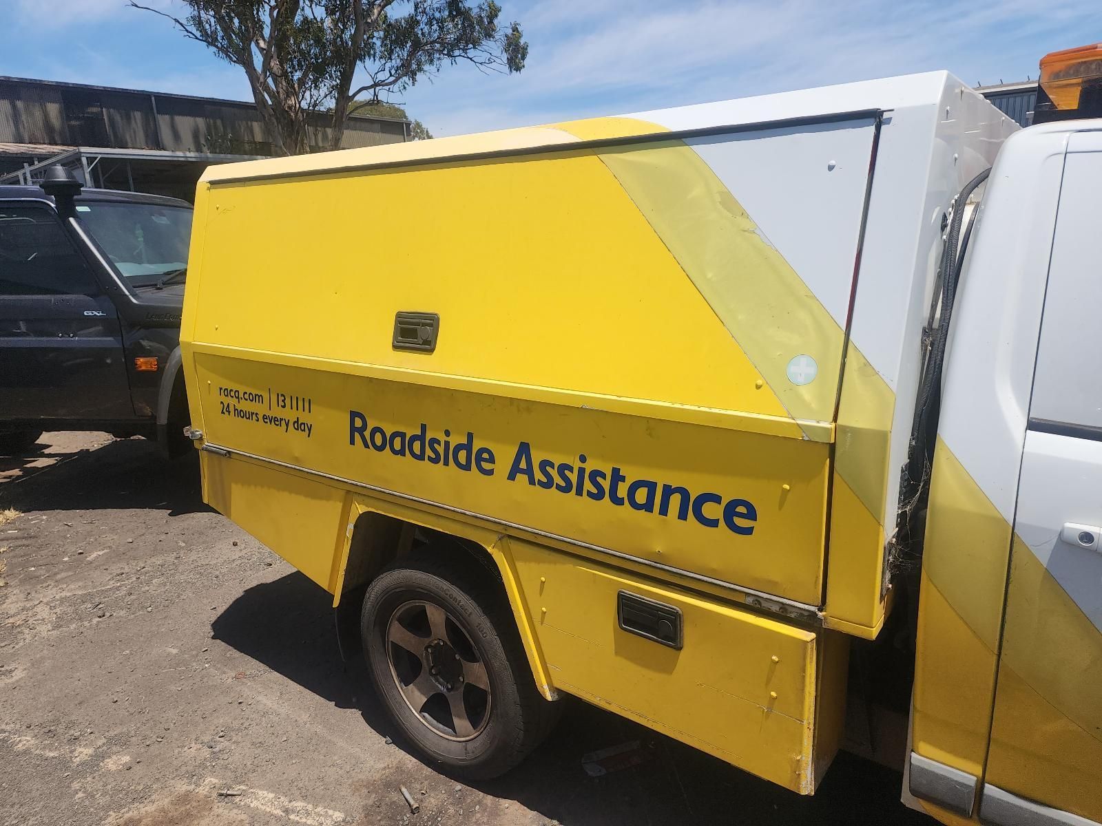 Yellow Roadside Assistance Truck Parked Outdoors — South West 4WD Wreckers In Harristown, QLD