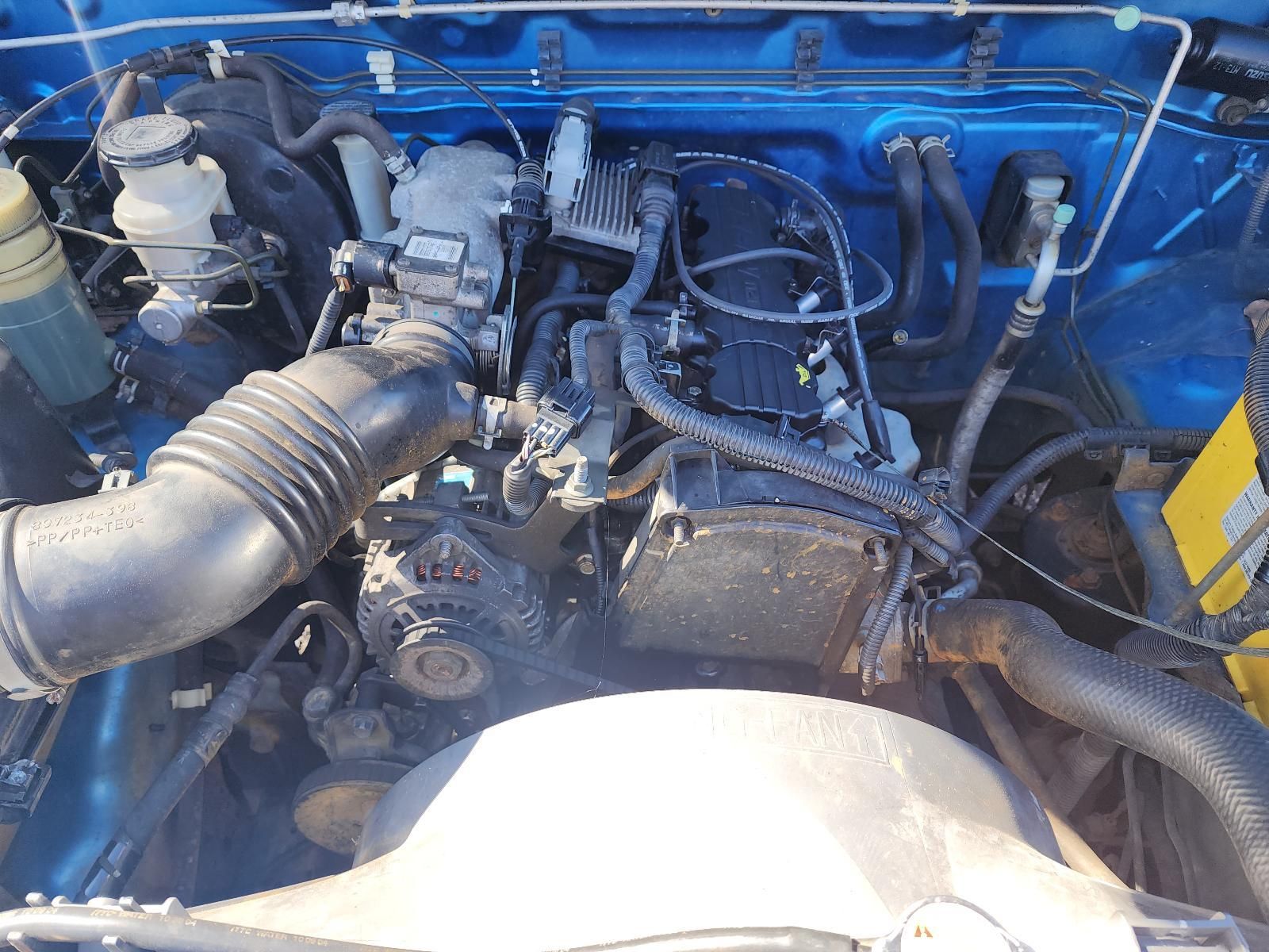 Blue Vehicle Engine Bay With Exposed Engine Components — South West 4WD Wreckers In Harristown, QLD