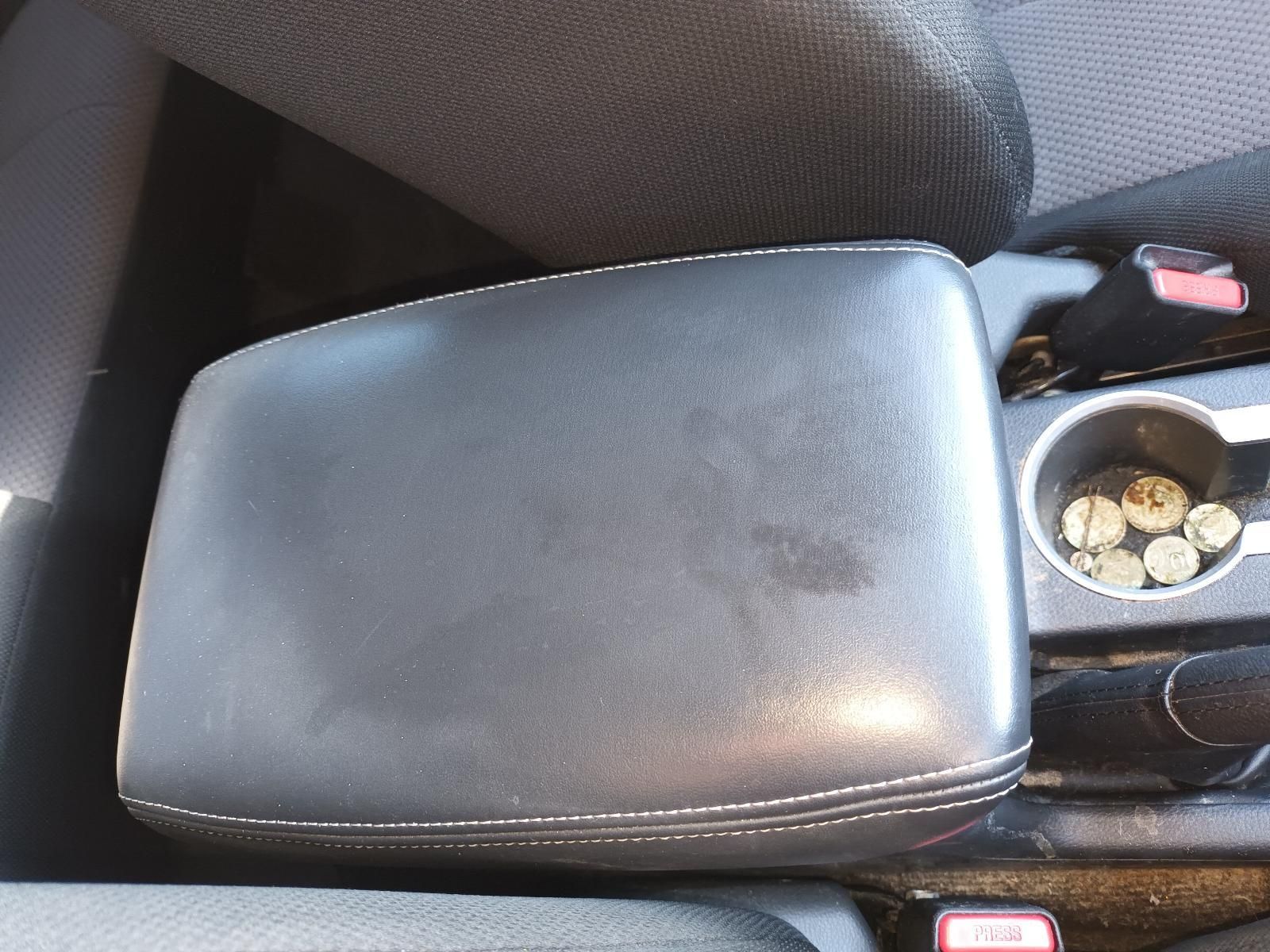 Closed Black Car Center Console Armrest Beside a Cup Holder — South West 4WD Wreckers In Harristown, QLD
