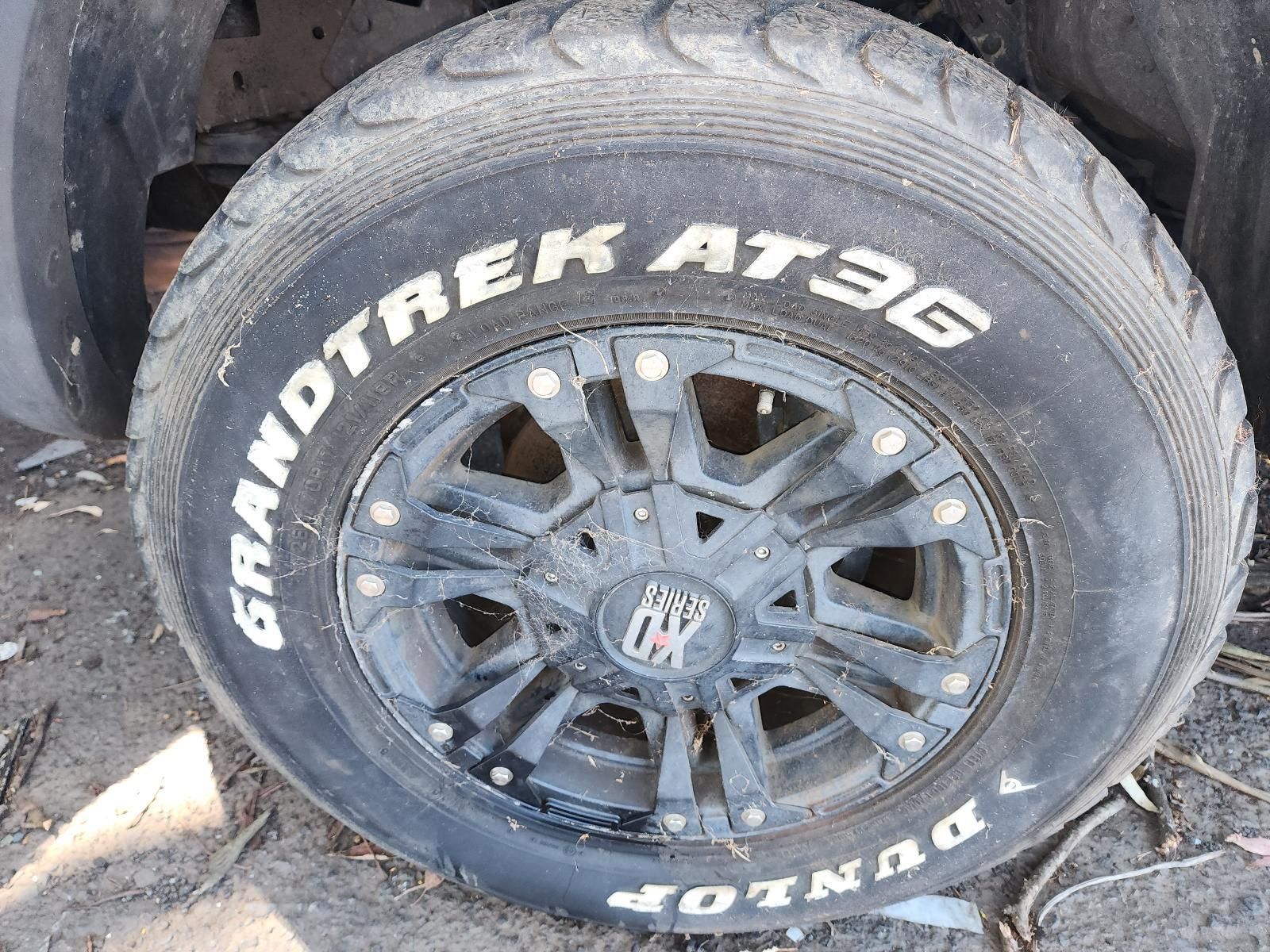 Close-up of a Dusty Car Wheel — South West 4WD Wreckers In Harristown, QLD