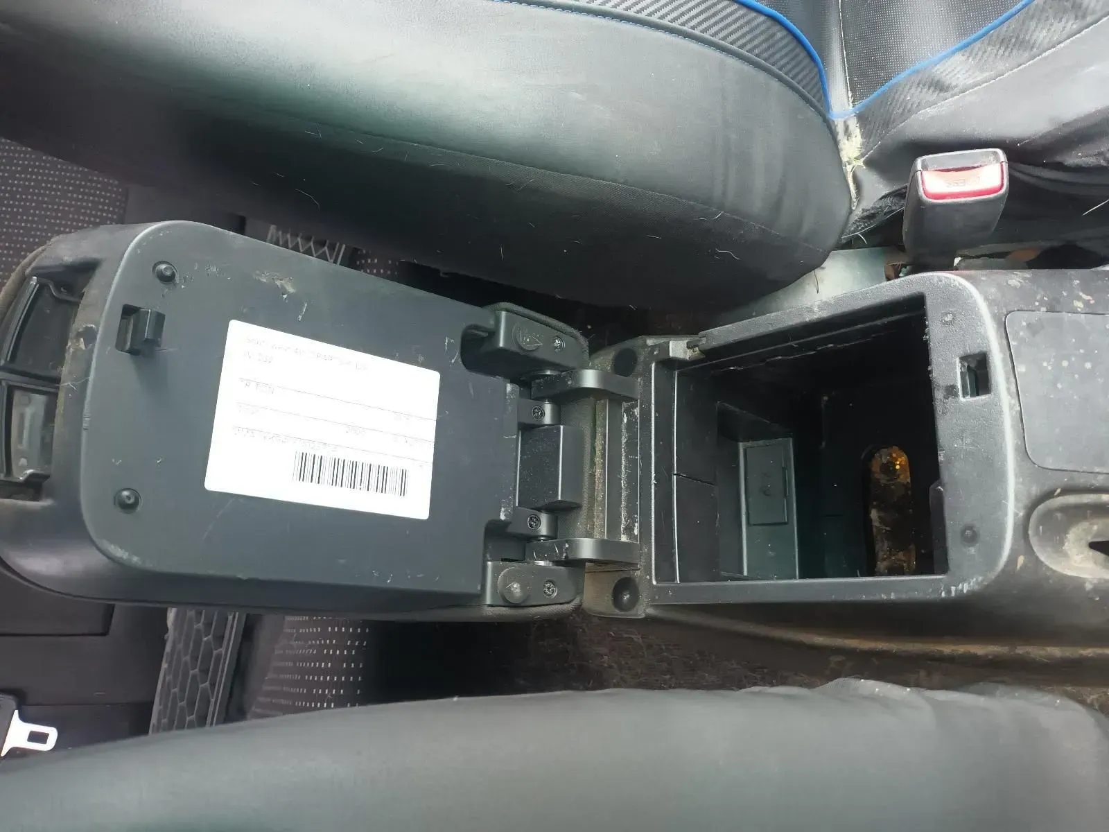 Open Car Center Console With a White Label, Near a Car Seat — South West 4WD Wreckers In Harristown, QLD