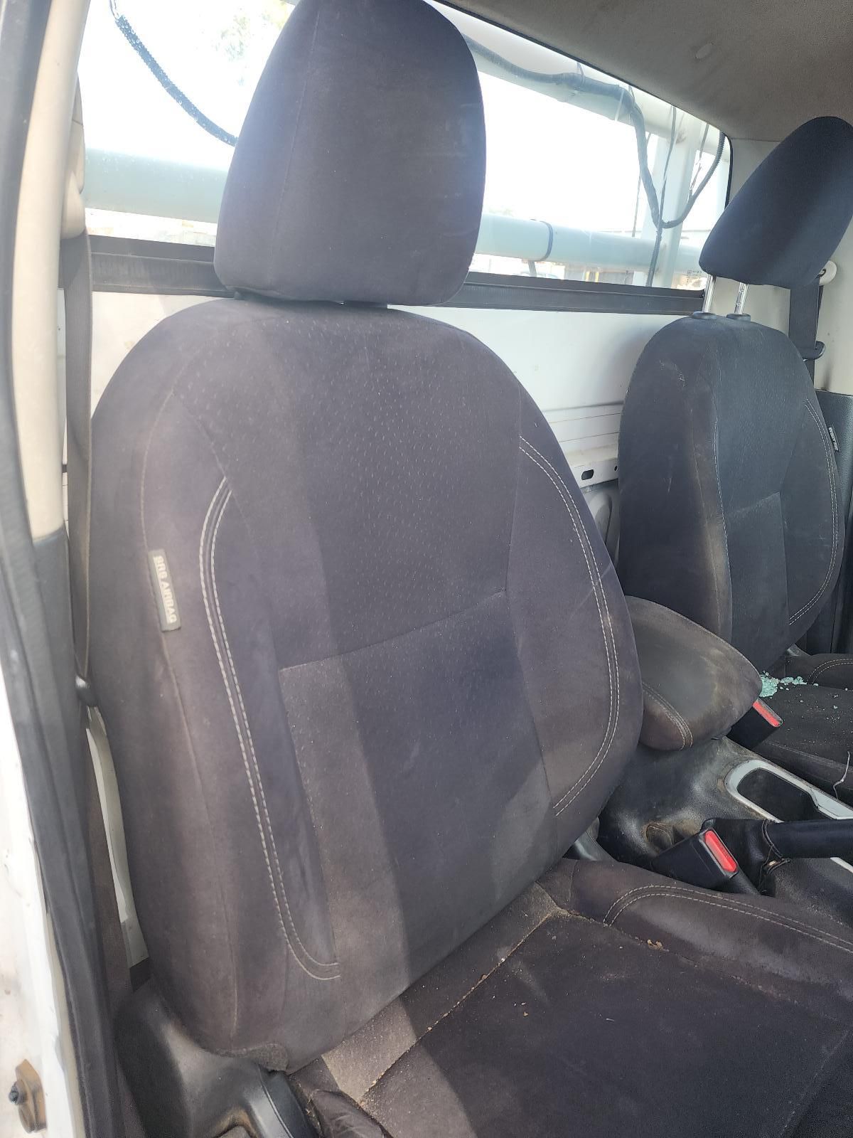Front Seats of a Vehicle With Dark Fabric Upholstery — South West 4WD Wreckers In Harristown, QLD