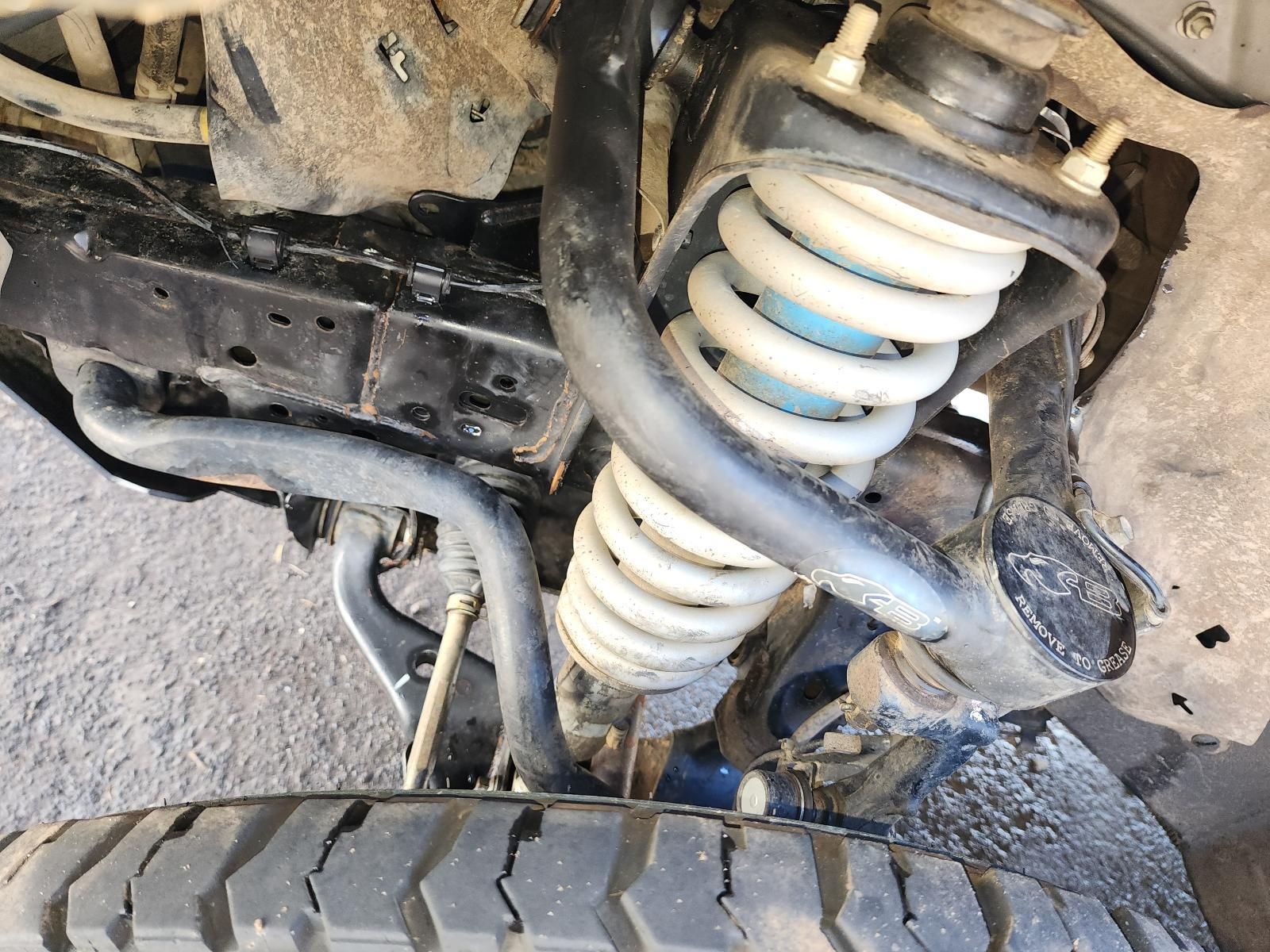 Close-up of an Off-road Vehicle’s Front Suspension and Wheel — South West 4WD Wreckers In Harristown, QLD