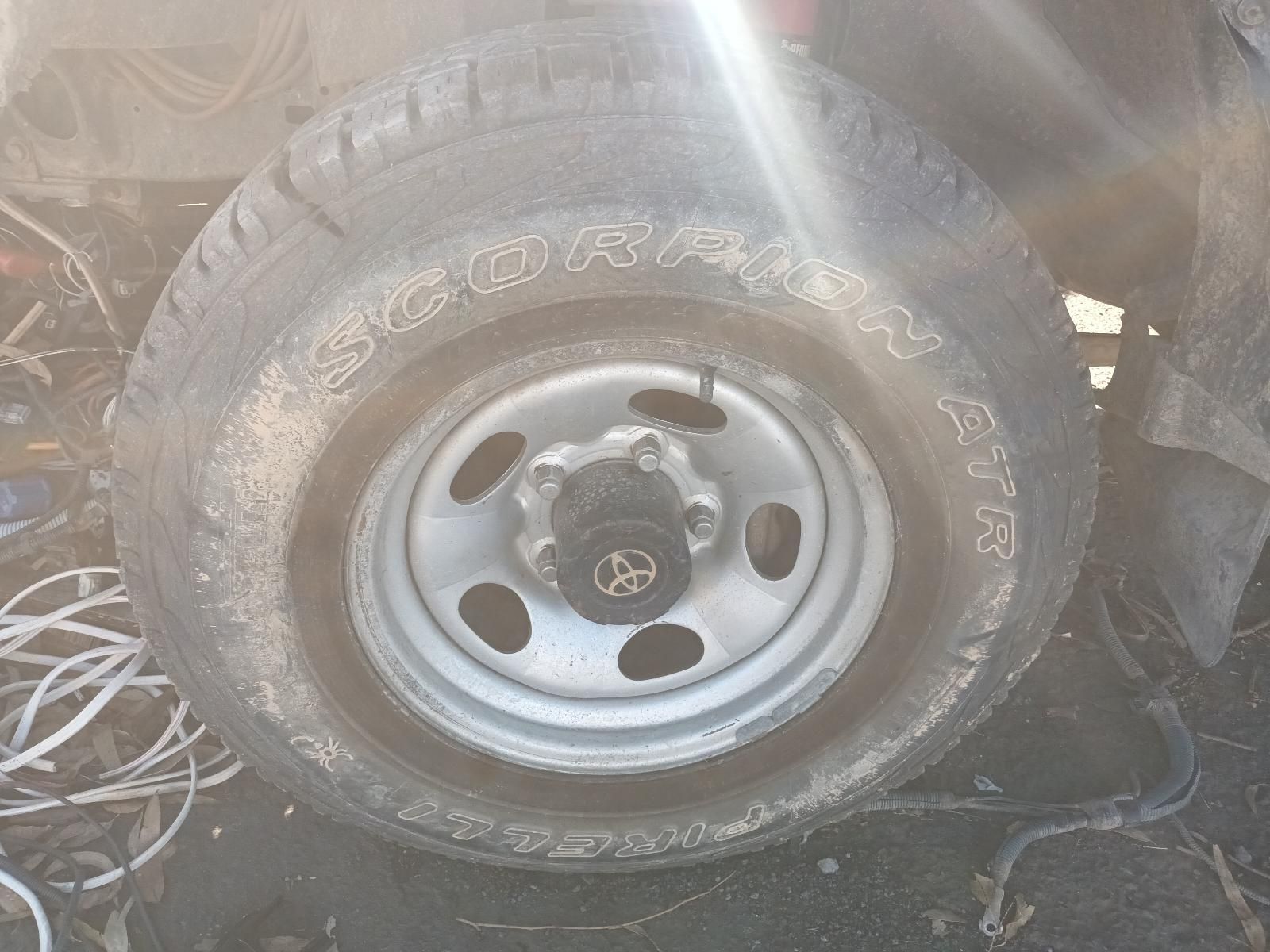 Close-Up of A Vehicle Wheel and Tyre with A Silver Rim — South West 4WD Wreckers In Harristown, QLD