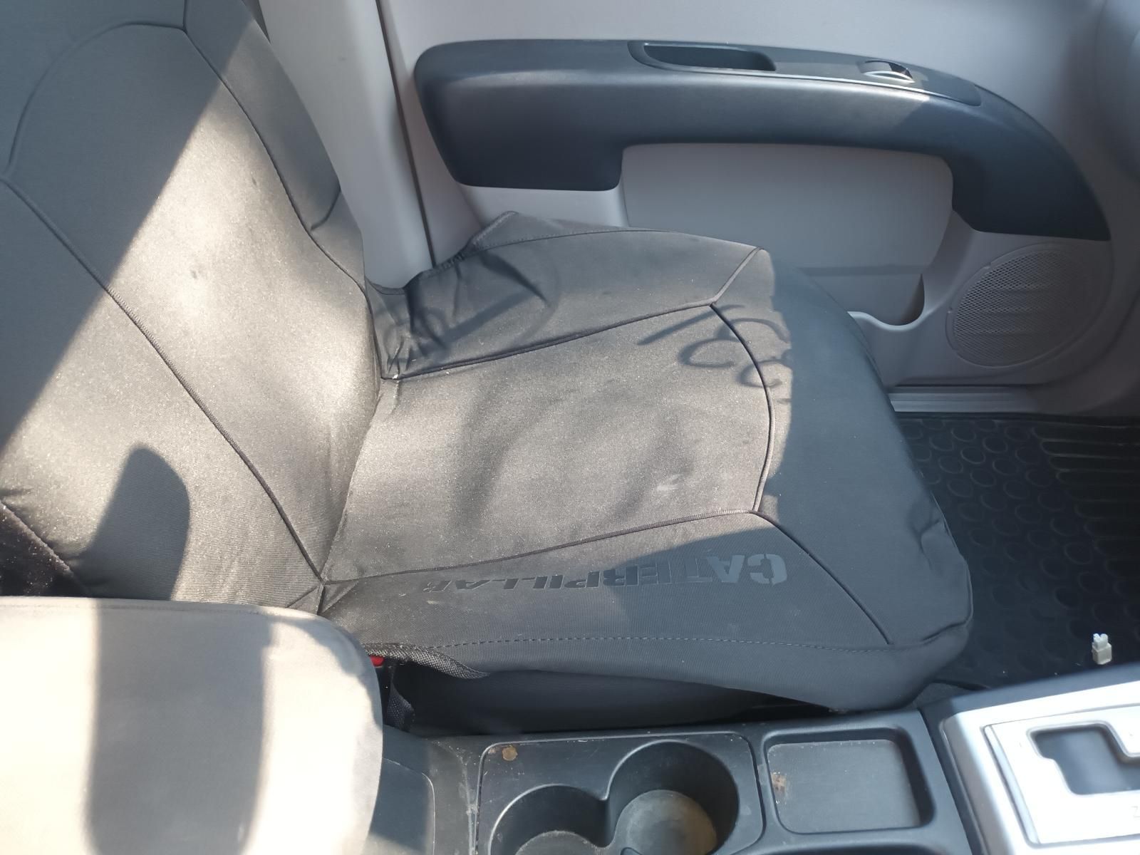 Car Seat with A Gray Cushion and Folded Cover Beside a Center Console — South West 4WD Wreckers In Harristown, QLD