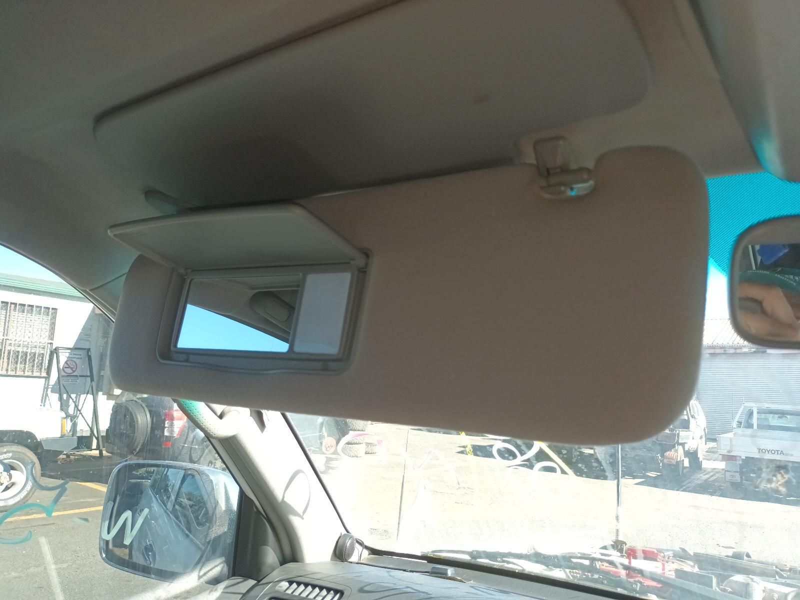 Car Sun Visor with A Small Built-In Mirror, Viewed from Inside a Parked Vehicle — South West 4WD Wreckers In Harristown, QLD