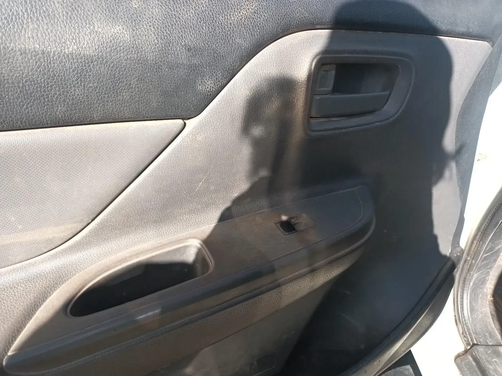 Dirty Gray Car Door Panel With a Hole — South West 4WD Wreckers In Harristown, QLD