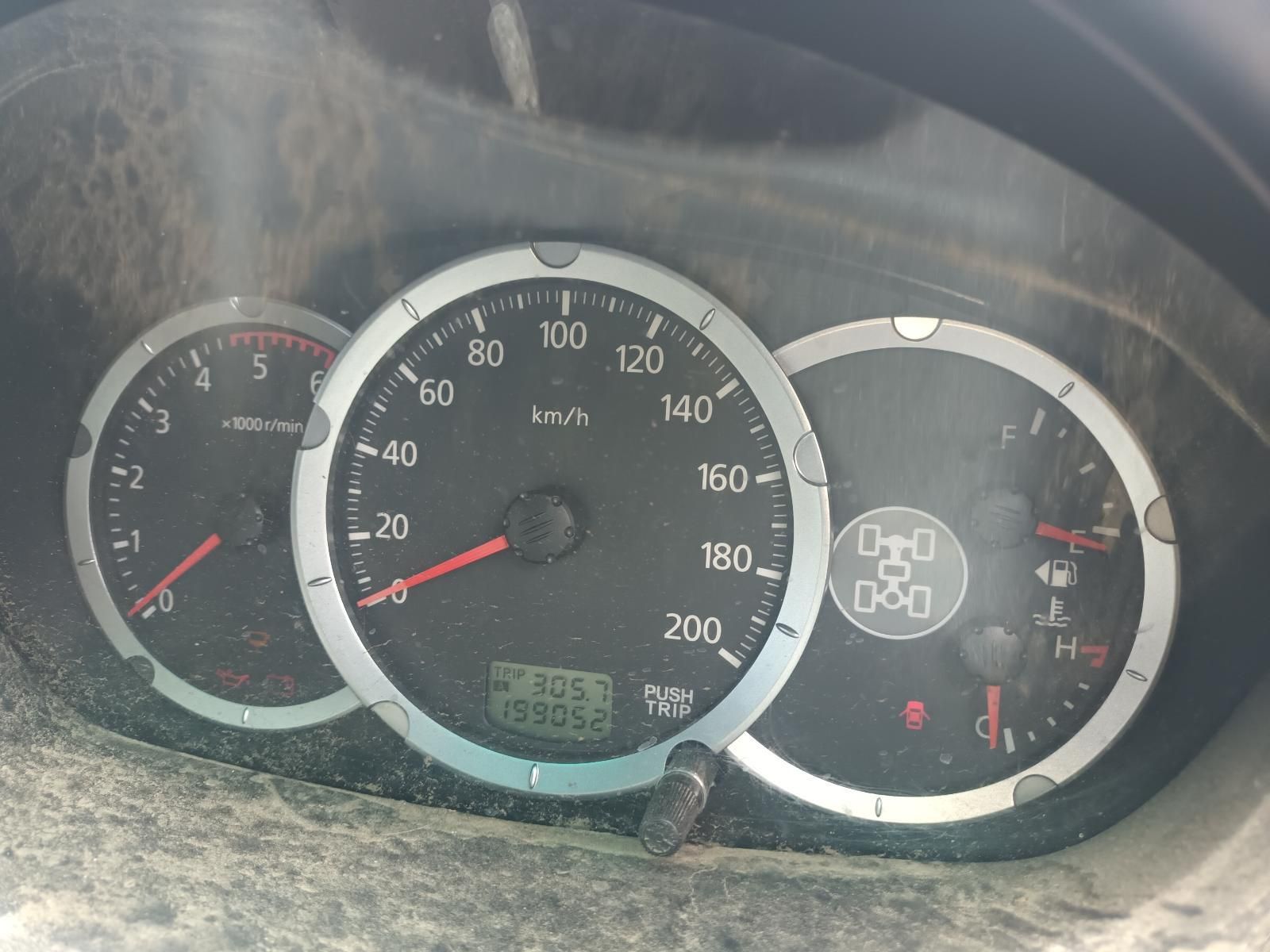 Dusty Car Dashboard with Speedometer, Gauges, and Warning Lights Illuminated — South West 4WD Wreckers In Harristown, QLD