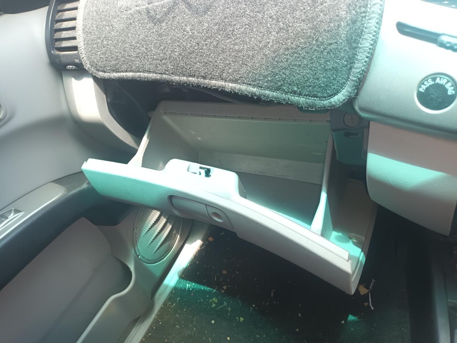 Broken White Car Interior Trim Hanging Near the Dashboard and Footwell — South West 4WD Wreckers In Harristown, QLD