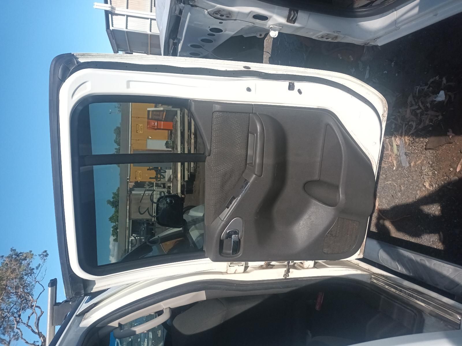 Open Car Door with Beige Interior, Parked Outdoors in A Driveway — South West 4WD Wreckers In Harristown, QLD