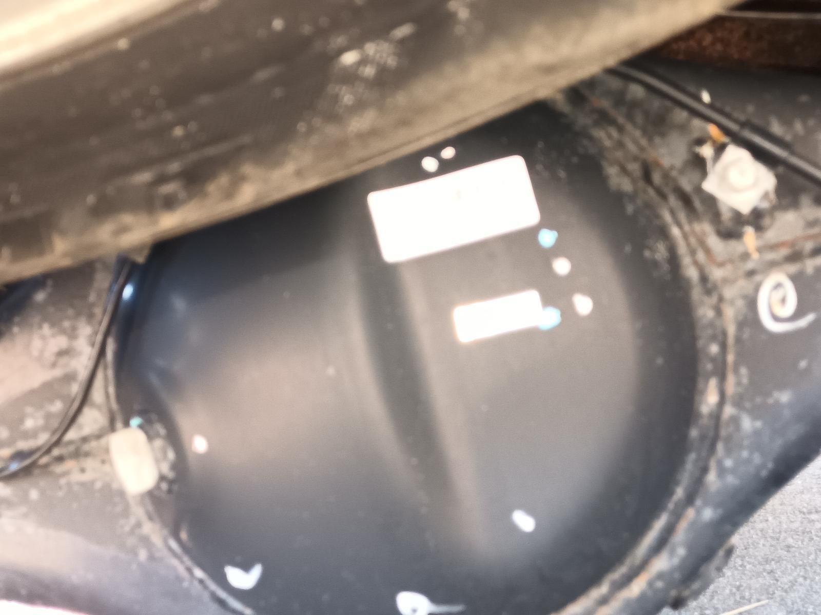 Black Round Tank or Container with White Labels — South West 4WD Wreckers In Harristown, QLD